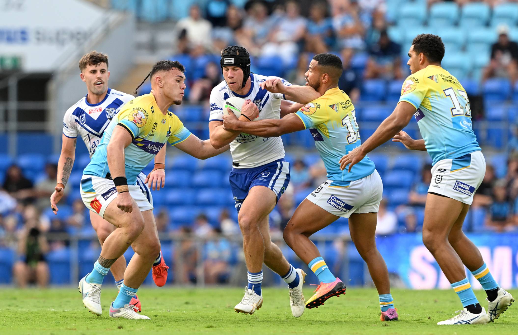GOLD COAST, AUSTRALIA - SEPTEMBER 03: Matt Burton of the Bulldogs takes on the defence during the round 27 NRL match between the Gold Coast Titans and Canterbury Bulldogs at Cbus Super Stadium on September 03, 2023 in Gold Coast, Australia. (Photo by Bradley Kanaris/Getty Images)