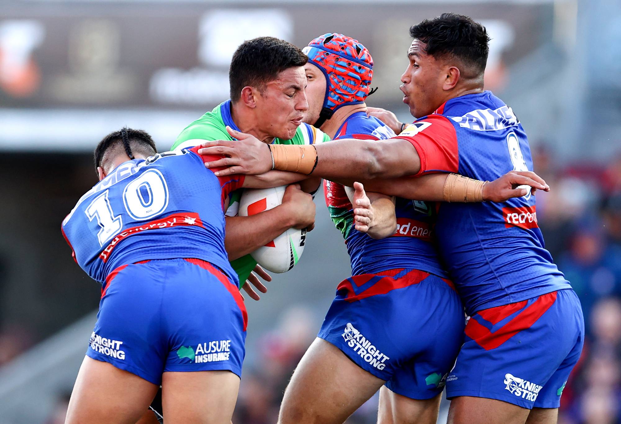 NEWCASTLE, AUSTRALIA - SEPTEMBER 10: Joseph Tapine of the Raiders is tackled by the Knights defence during the NRL Elimination Final match between Newcastle Knights and Canberra Raiders at McDonald Jones Stadium on September 10, 2023 in Newcastle, Australia. (Photo by Brendon Thorne/Getty Images)