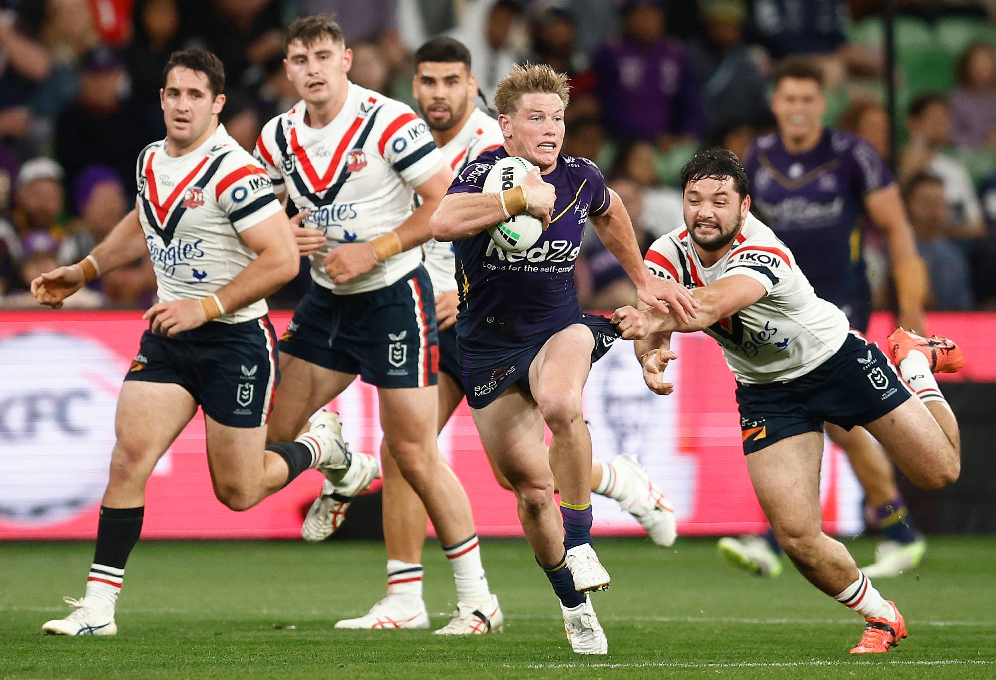 MELBOURNE, AUSTRALIA - SEPTEMBER 15: Harry Grant of the Storm is tackled during the NRL Semi Final match between Melbourne Storm and the Sydney Roosters at AAMI Park on September 15, 2023 in Melbourne, Australia. (Photo by Daniel Pockett/Getty Images)
