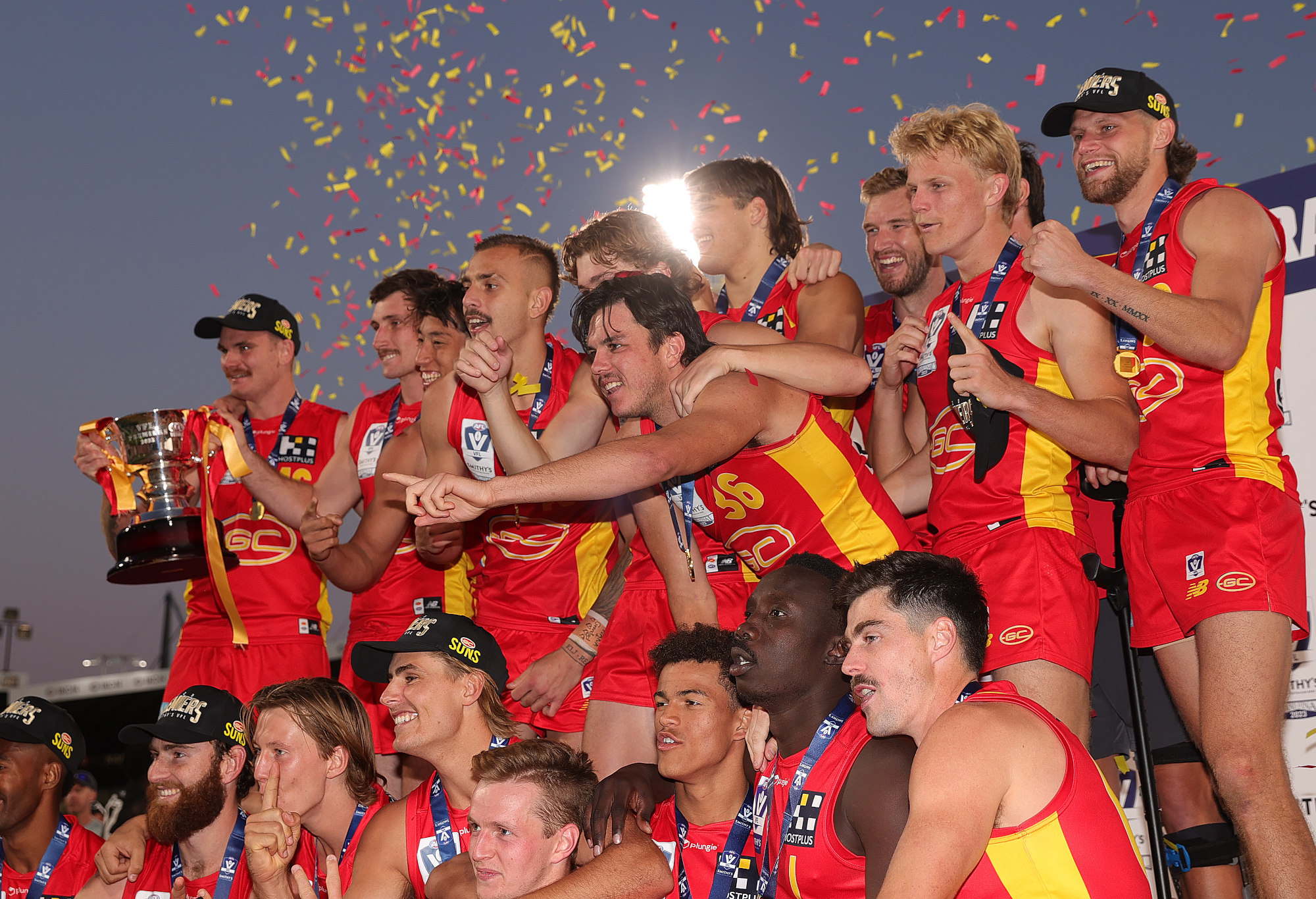 The Gold Coast Suns pose with the VFL Premiership Cup.