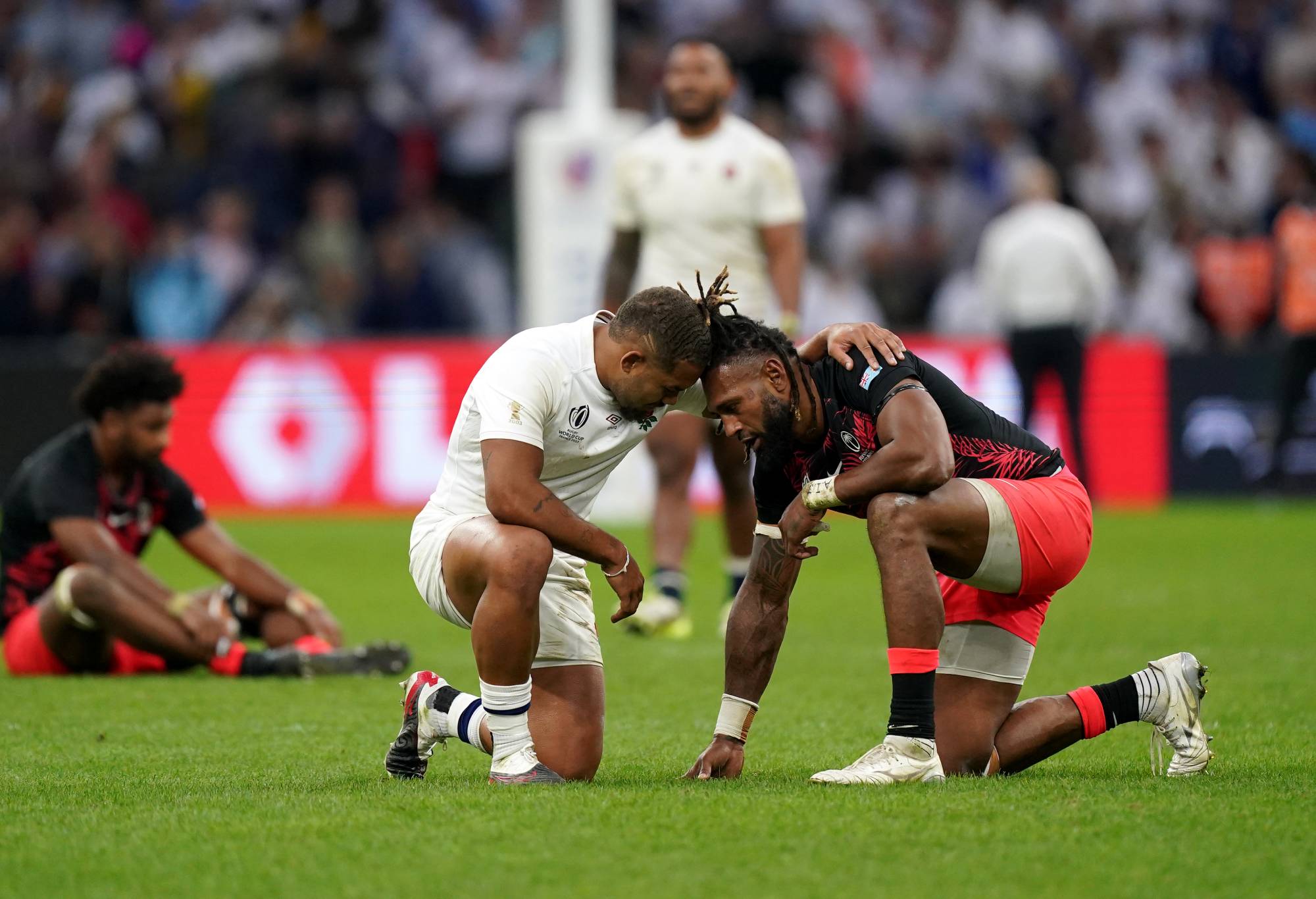 England's Ollie Lawrence consoles Fiji's Waisea Nayacalevu after the Rugby World Cup 2023 quarter-final match at the Stade Velodrome in Marseille, France. Picture date: Sunday October 15, 2023. (Photo by Mike Egerton/PA Images via Getty Images)