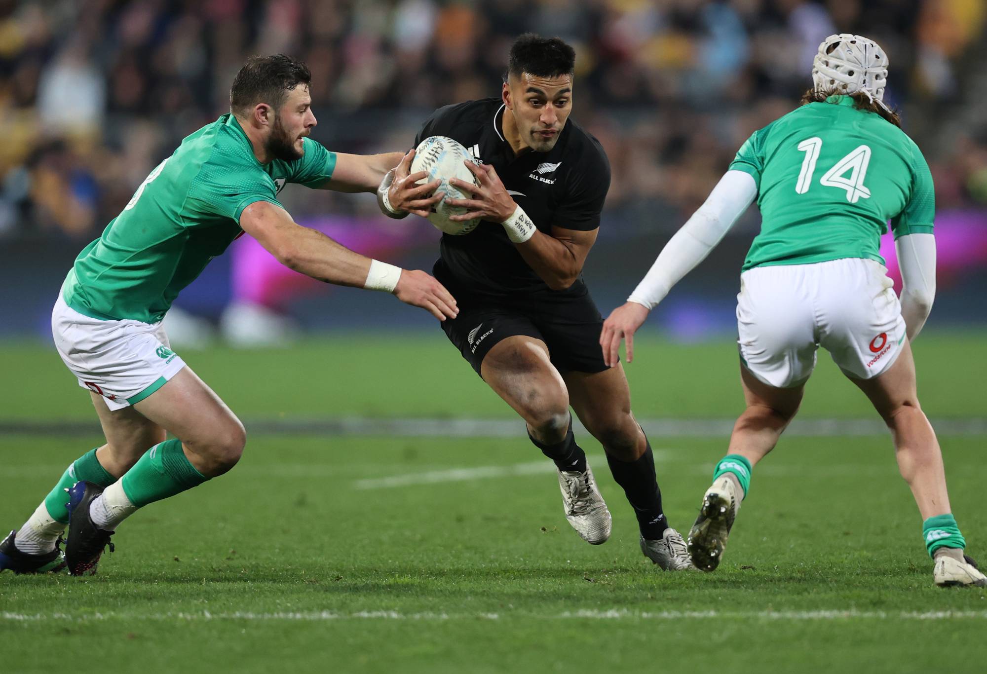 Rieko Ioane of the All Blacks (C) looks for a gap during the International Test match between the New Zealand All Blacks and Ireland at Sky Stadium on July 16, 2022 in Wellington, New Zealand. (Photo by Phil Walter/Getty Images)