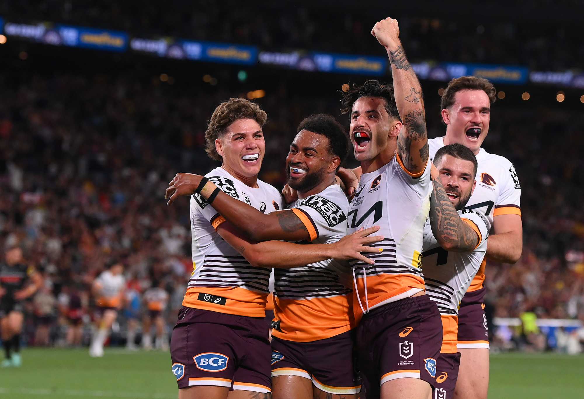 SYDNEY, AUSTRALIA - OCTOBER 01: Ezra Mam of the Broncos celebrates with team mates after scoring a try during the 2023 NRL Grand Final match between Penrith Panthers and Brisbane Broncos at Accor Stadium on October 01, 2023 in Sydney, Australia. (Photo by Bradley Kanaris/Getty Images)