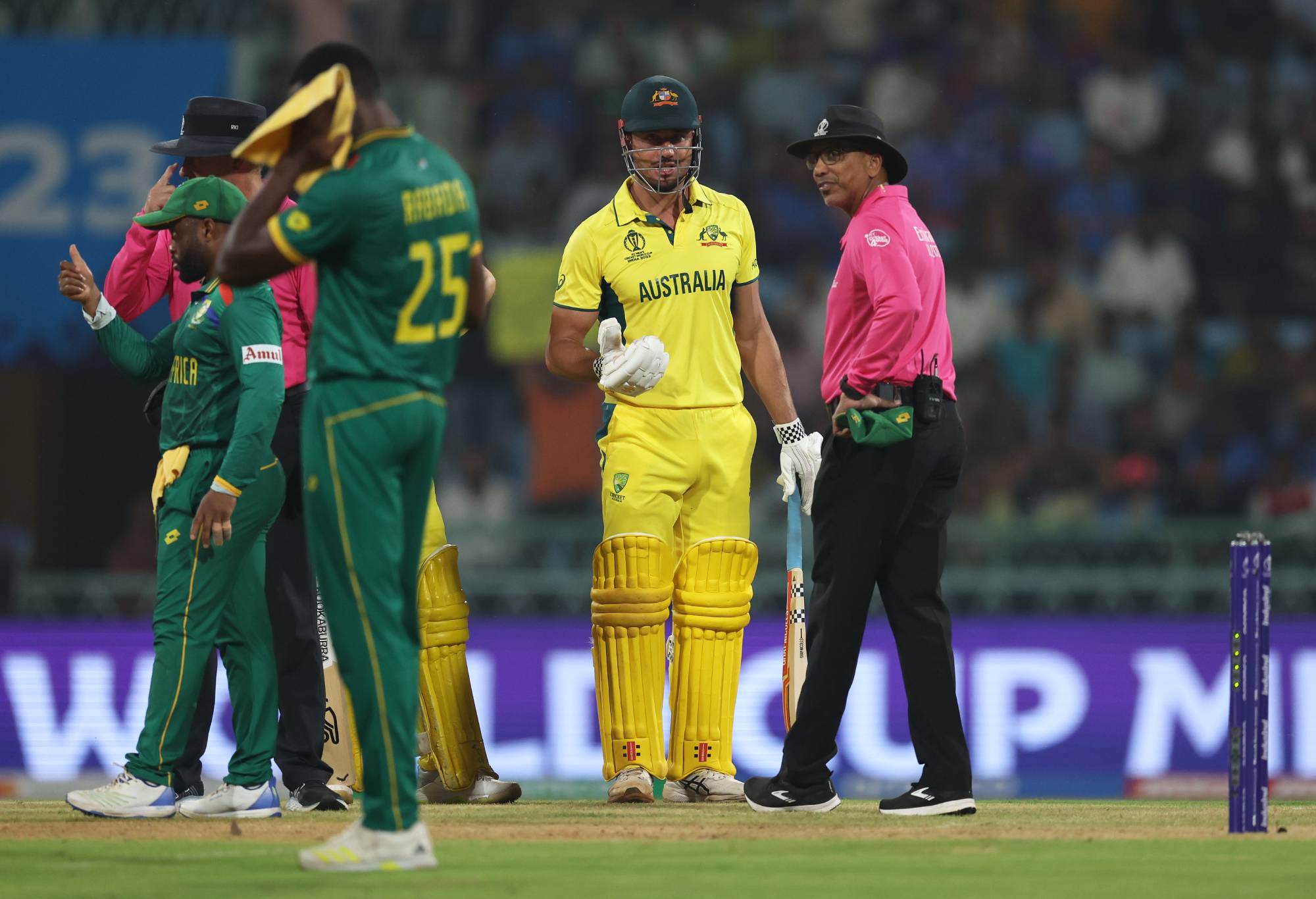 LUCKNOW, INDIA - OCTOBER 12: Marcus Stoinis of Australia interacts with Match Umpire Joel Wilson after being dismissed from a review during the ICC Men's Cricket World Cup India 2023 between Australia and South Africa at BRSABVE Cricket Stadium on October 12, 2023 in Lucknow, India. (Photo by Matthew Lewis-ICC/ICC via Getty Images)