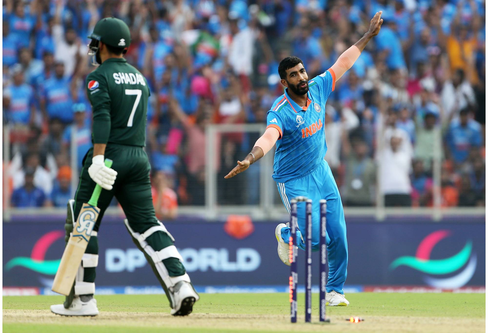 AHMEDABAD, INDIA - OCTOBER 14: Jasprit Bumrah of India celebrates the wicket of Shadab Khan of Pakistan during the ICC Men's Cricket World Cup India 2023 between India and Pakistan at Narendra Modi Stadium on October 14, 2023 in Ahmedabad, India. (Photo by Surjeet Yadav-ICC/ICC via Getty Images)