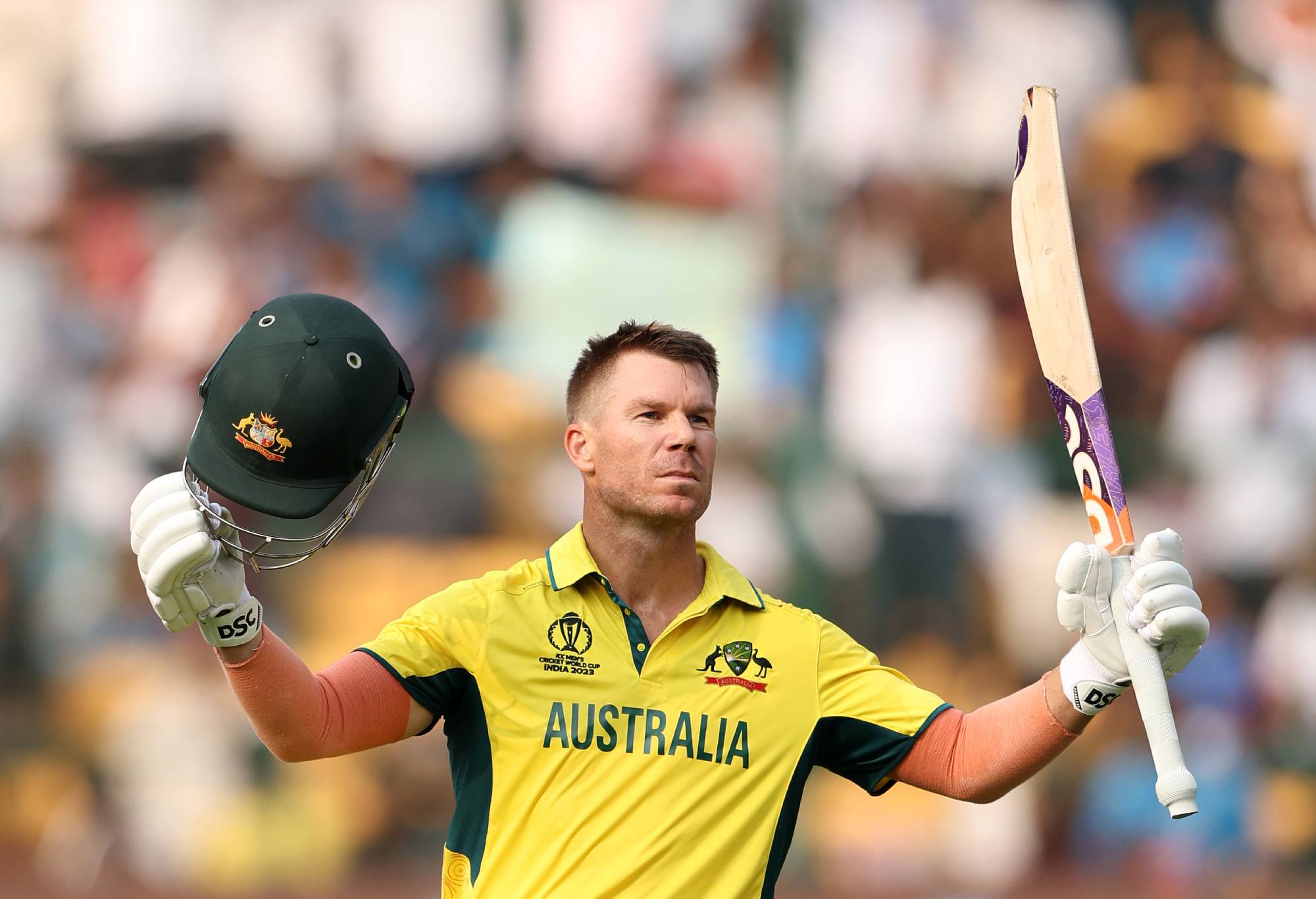 BANGALORE, INDIA - OCTOBER 20: David Warner of Australia celebrates their century during the ICC Men's Cricket World Cup India 2023 between Australia and Pakistan at M. Chinnaswamy Stadium on October 20, 2023 in Bangalore, India. (Photo by Robert Cianflone/Getty Images)