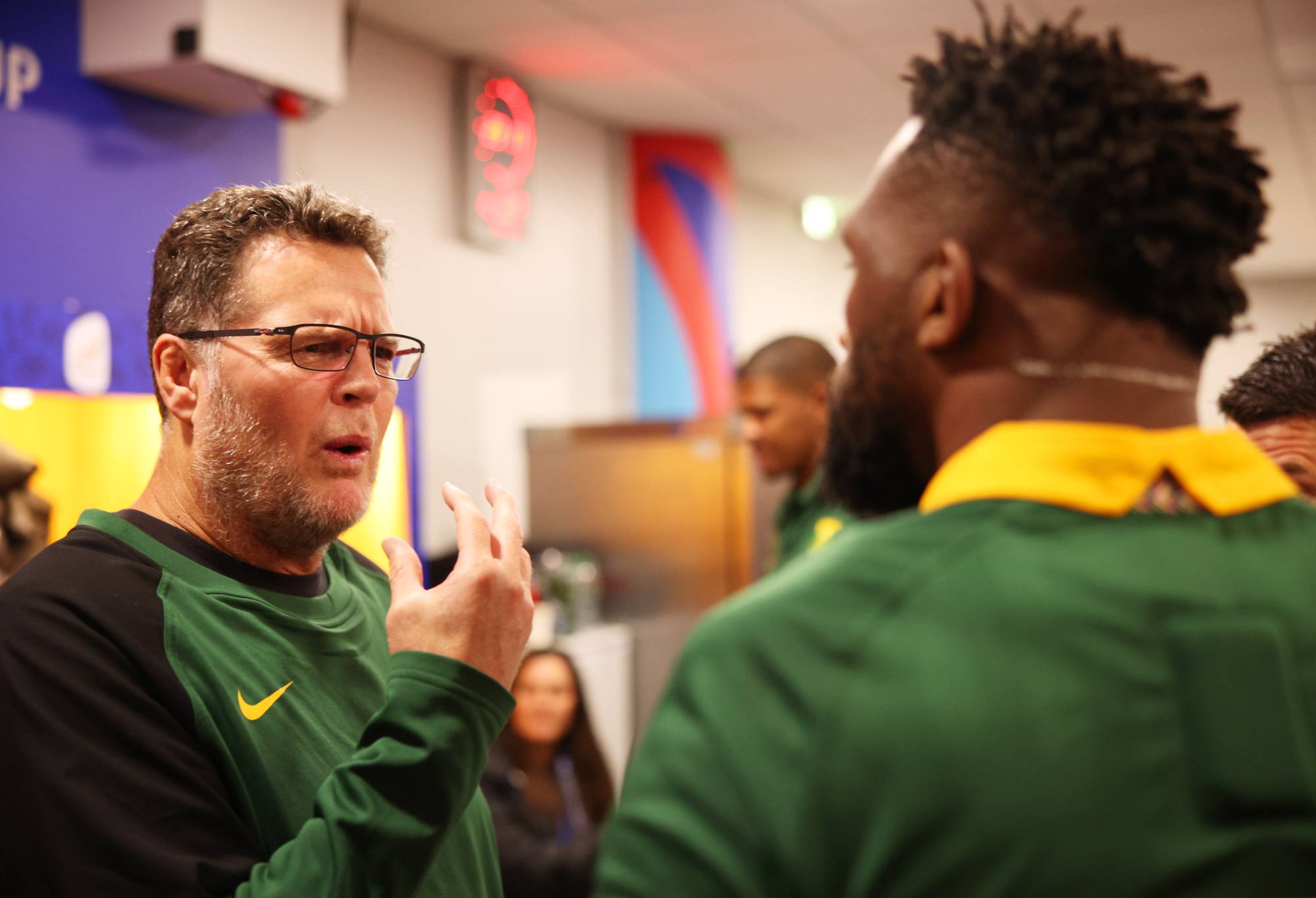 Rassie Erasmus, Coach of South Africa interacts with Siya Kolisi of South Africa inside the South Africa dressing room following the Rugby World Cup France 2023 match between England and South Africa at Stade de France on October 21, 2023 in Paris, France. (Photo by Adam Pretty - World Rugby/World Rugby via Getty Images)
