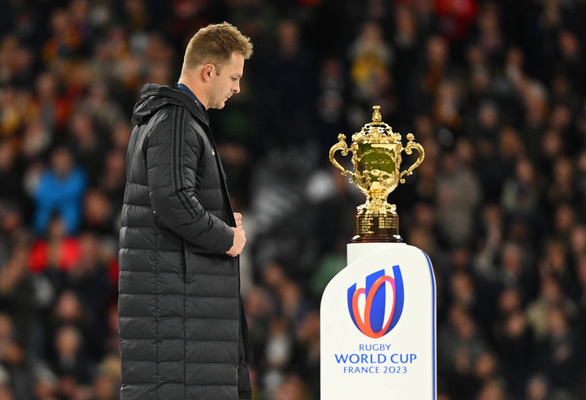 Sam Cane of New Zealand walks past the The Webb Ellis Cup following the Rugby World Cup Final match between New Zealand and South Africa at Stade de France on October 28, 2023 in Paris, France. (Photo by David Ramos - World Rugby/World Rugby via Getty Images)