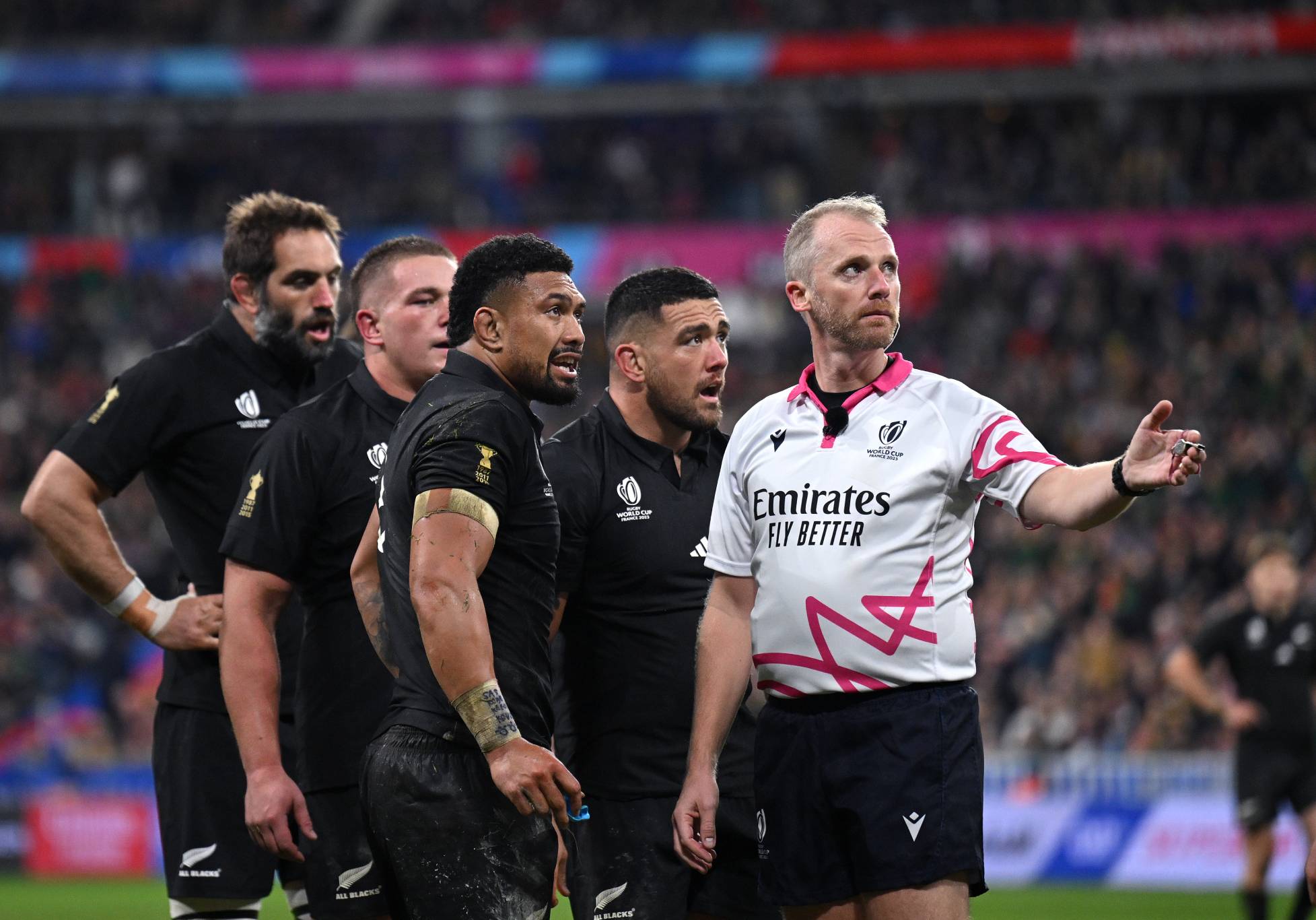 Ardie Savea of New Zealand and teammates talk to Referee Wayne Barnes during the Rugby World Cup Final match between New Zealand and South Africa at Stade de France on October 28, 2023 in Paris, France. (Photo by Hannah Peters/Getty Images)