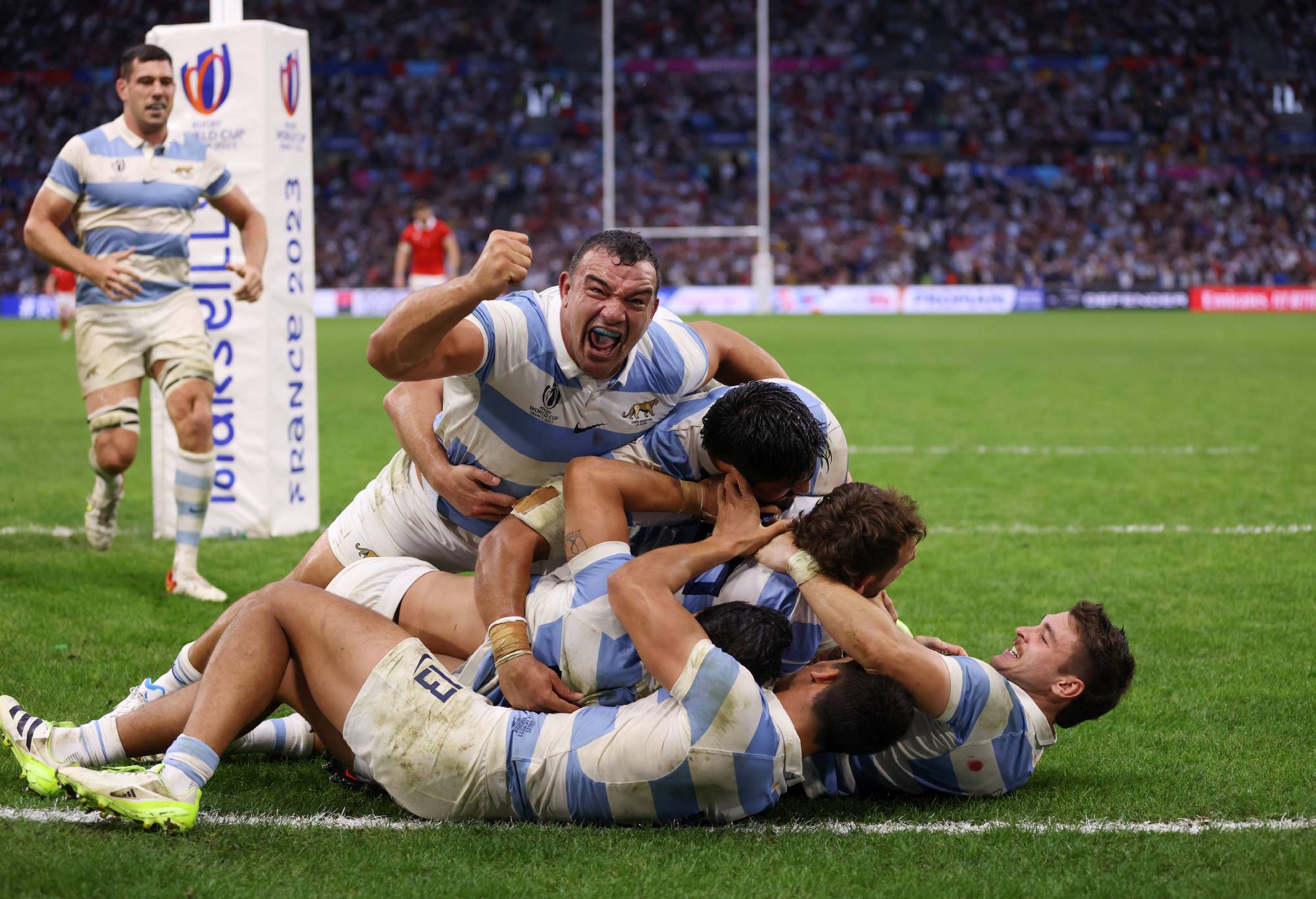 Nicolas Sanchez of Argentina celebrates with teammates after scoring the team's second try during the Rugby World Cup France 2023 Quarter Final match between Wales and Argentina at Stade Velodrome on October 14, 2023 in Marseille, France. (Photo by Paul Harding/Getty Images)