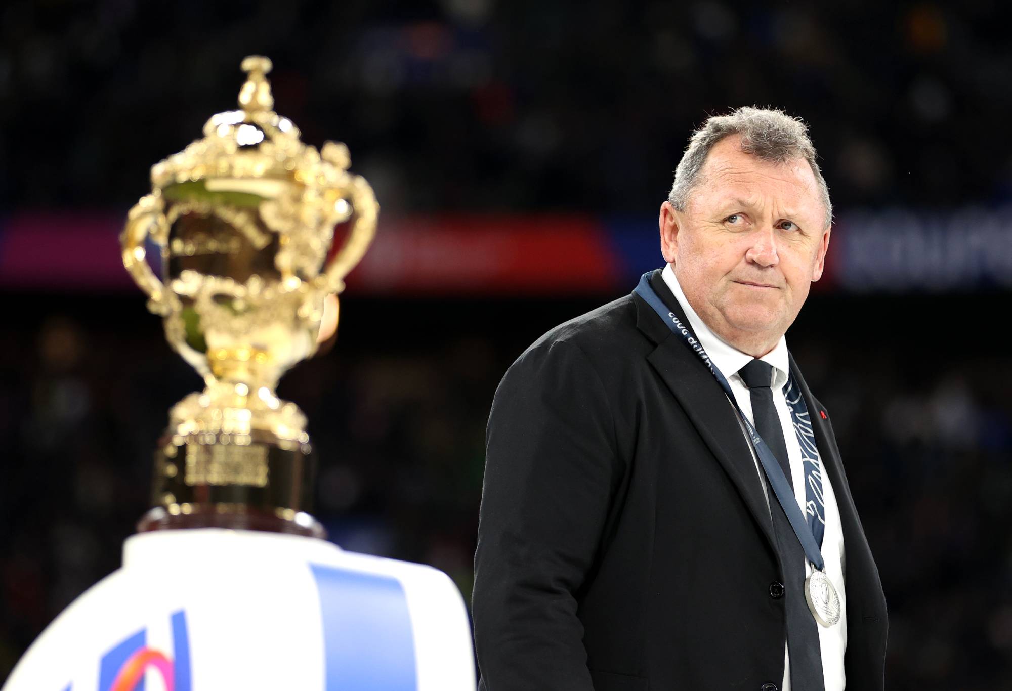 Ian Foster, Head Coach of New Zealand, looks on as he walks past The Webb Ellis Cup during the Rugby World Cup Final match between New Zealand and South Africa at Stade de France on October 28, 2023 in Paris, France. (Photo by Michael Steele - World Rugby/World Rugby via Getty Images)