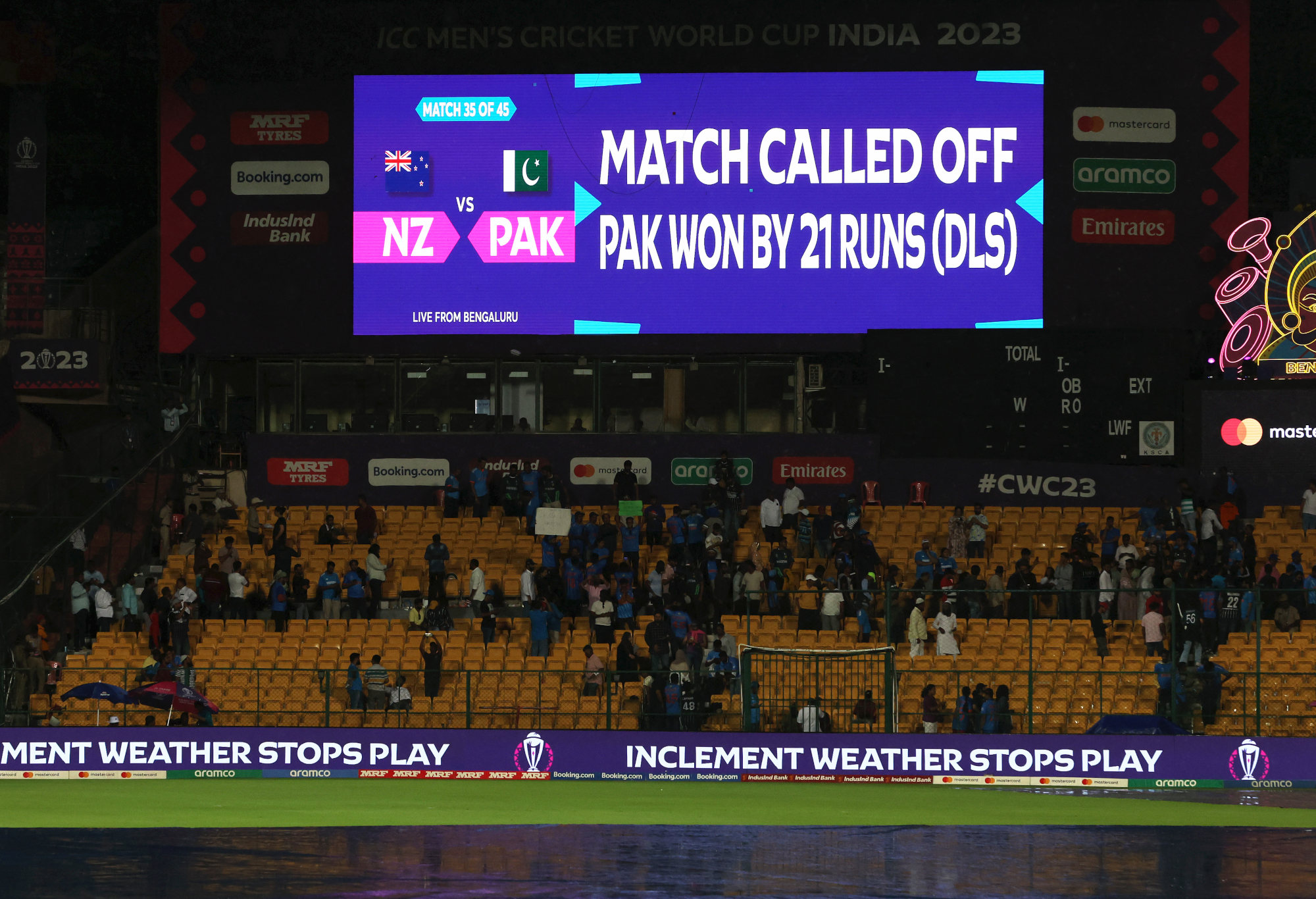 The Bengaluru scoreboard proclaims Pakistan's victory over New Zealand via the Duckworth-Lewis-Stern system.