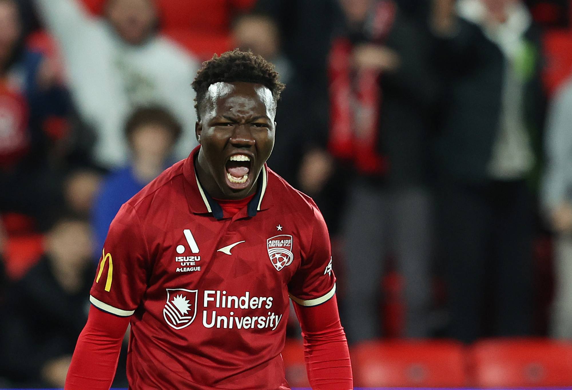 Nestory Irankunda of Adelaide United reacts after Craig Goodwin of United. awarded a free kick during the A-League Men's Elimination Final match between Adelaide United and Wellington Phoenix at Coopers Stadium on May 05, 2023, in Adelaide, Australia. (Photo by Sarah Reed/Getty Images)