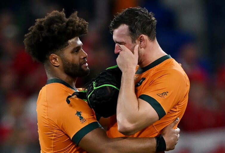 Rob Valetini consoles Nick Frost of Australia at full-time following the Rugby World Cup France 2023 match between Wales and Australia at Parc Olympique on September 24, 2023 in Lyon, France. (Photo by Hannah Peters/Getty Images)