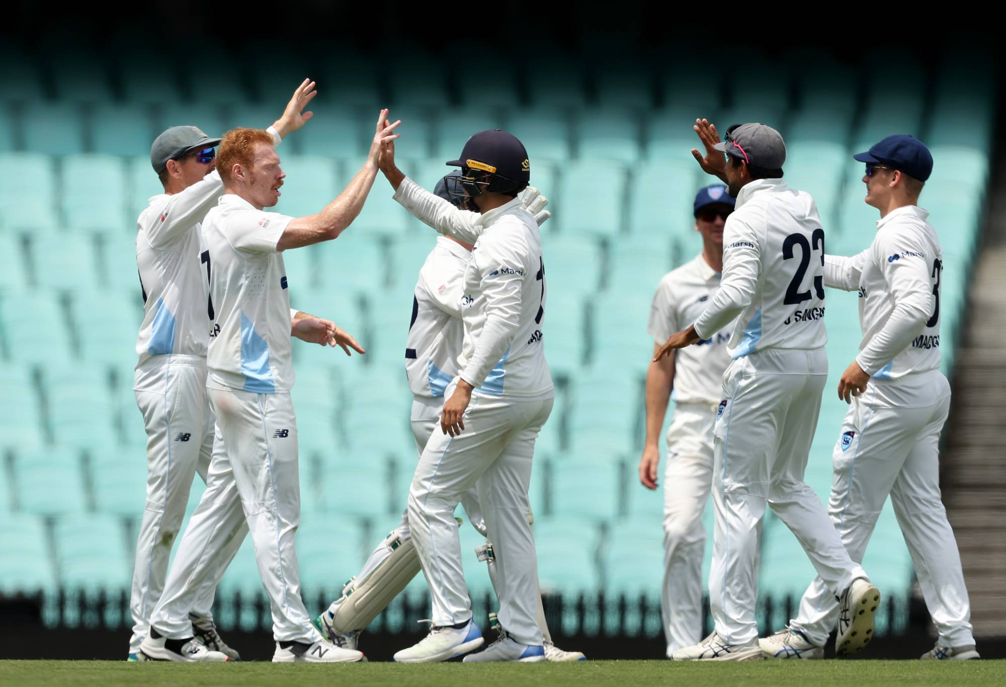 SYDNEY, AUSTRALIA - NOVEMBER 08: Liam Hatcher of New South Wales celebrates with team mates after taking the wicket of Charlie Stobo of Western Australia during the Sheffield Shield match between New South Wales and Western Australia at SCG, on November 08, 2023, in Sydney, Australia. (Photo by Matt King/Getty Images)