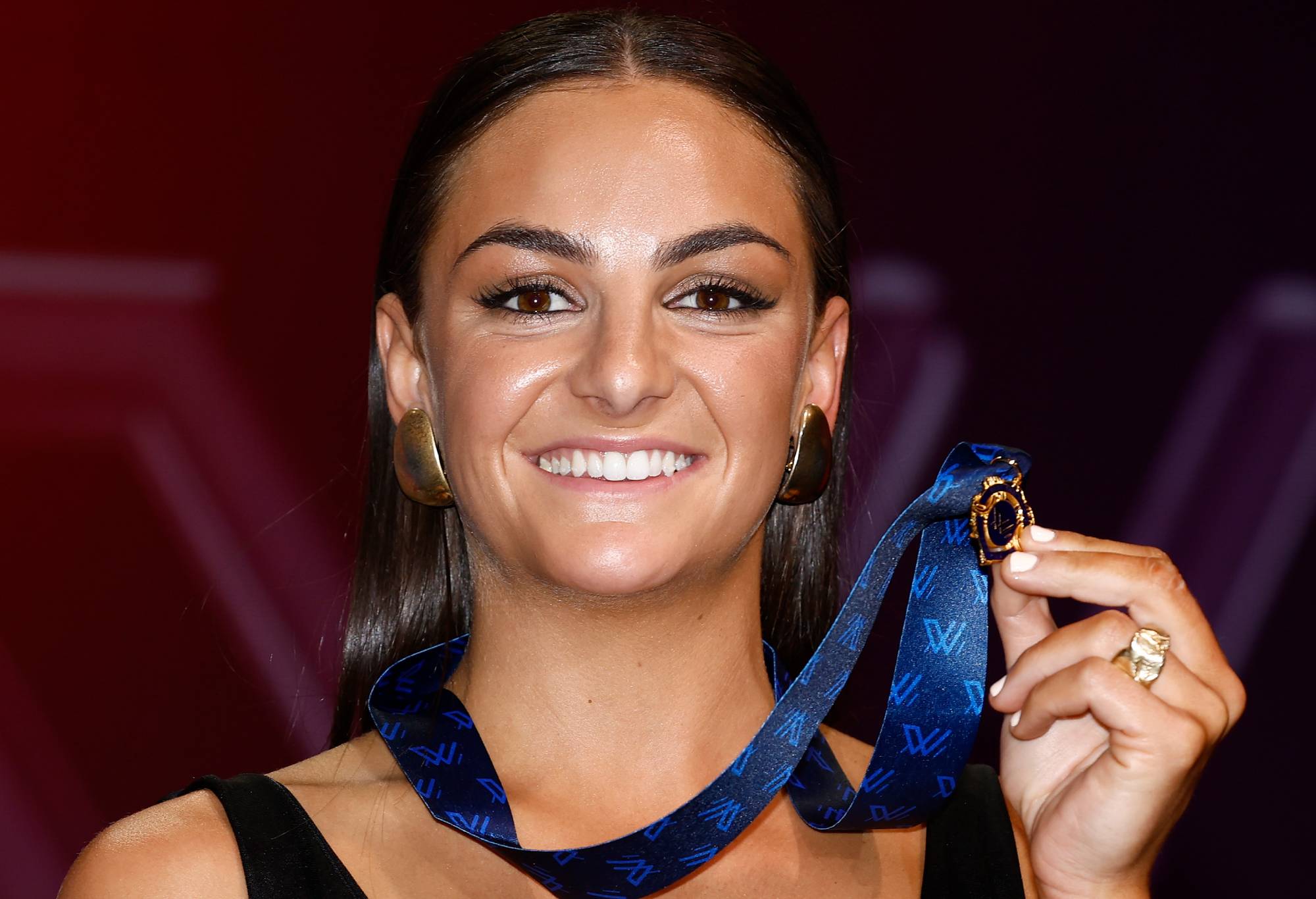 MELBOURNE, AUSTRALIA - NOVEMBER 27: Monique Conti of the Tigers poses with the AFLW Best and Fairest and trophy during the 2023 W Awards at Crown Palladium on November 27, 2023 in Melbourne, Australia. (Photo by Michael Willson/AFL Photos via Getty Images)