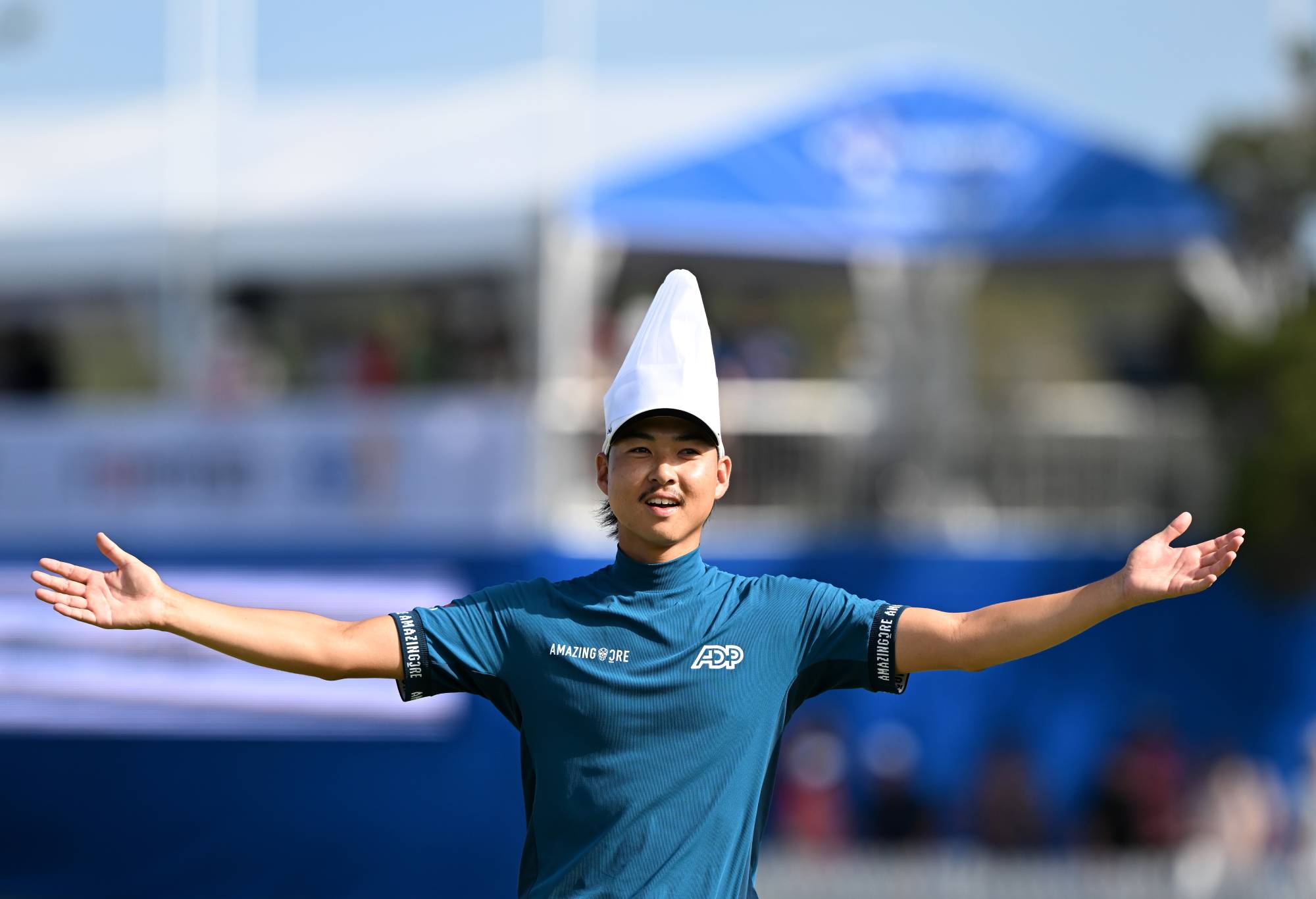 BRISBANE, AUSTRALIA - NOVEMBER 26: Min Woo Lee of Australia interacts with the crowd on the 17th hole whilst wearing a chefs hat during day four of the 2023 Australian PGA Championship at Royal Queensland Golf Club on November 26, 2023 in Brisbane, Australia. (Photo by Bradley Kanaris/Getty Images)