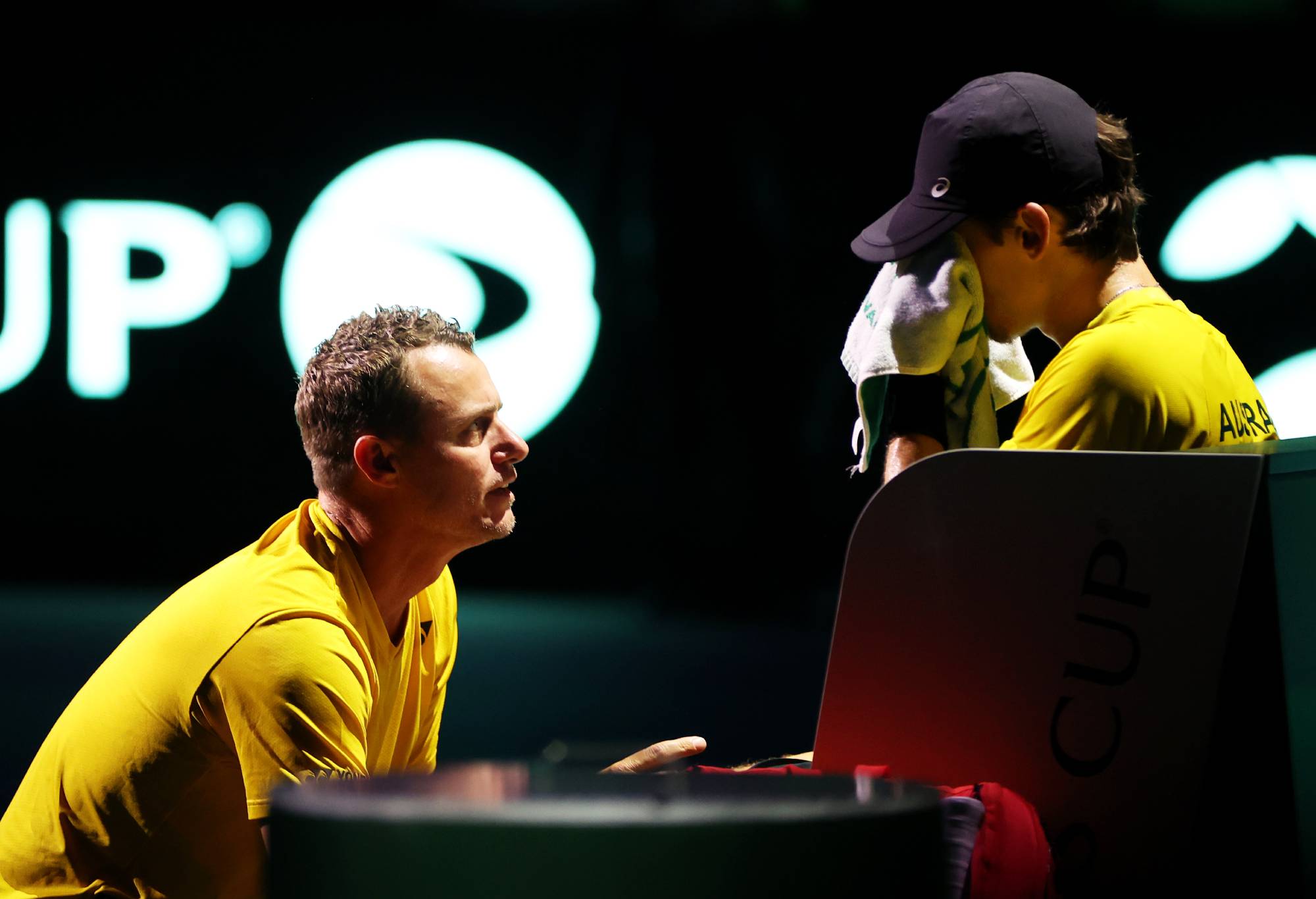 MALAGA, SPAIN - NOVEMBER 26: Lleyton Hewitt speaks to Alex De Minaur of Australia during the Davis Cup Final match against Italy at Palacio de Deportes Jose Maria Martin Carpena on November 26, 2023 in Malaga, Spain. (Photo by Clive Brunskill/Getty Images for ITF)