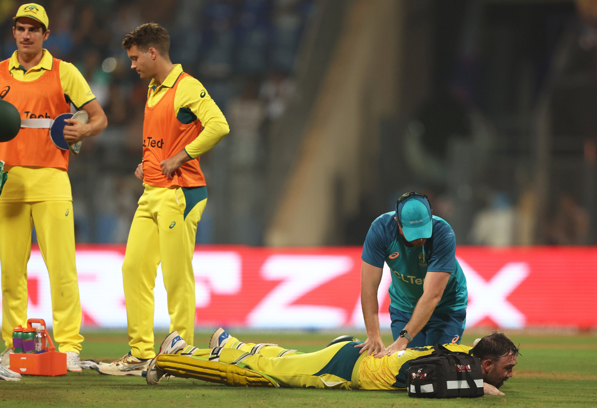 Glenn Maxwell receives physio treatment after suffering a full-body cramp.