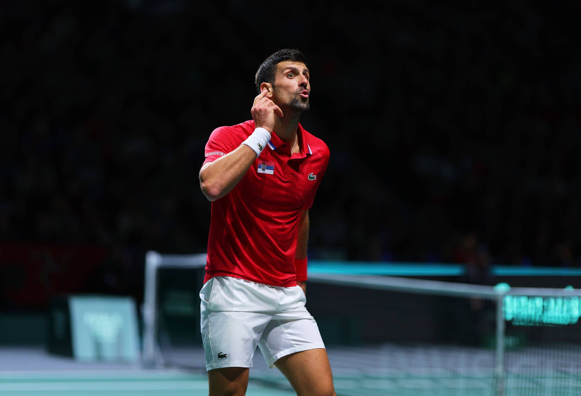 Novak Djokovic of Team Serbia reacts during the Quarter Final match between Serbia and Great Britain at Palacio de Deportes Jose Maria Martin Carpena on November 23, 2023 in Malaga, Spain. (Photo by Fran Santiago/Getty Images for ITF)