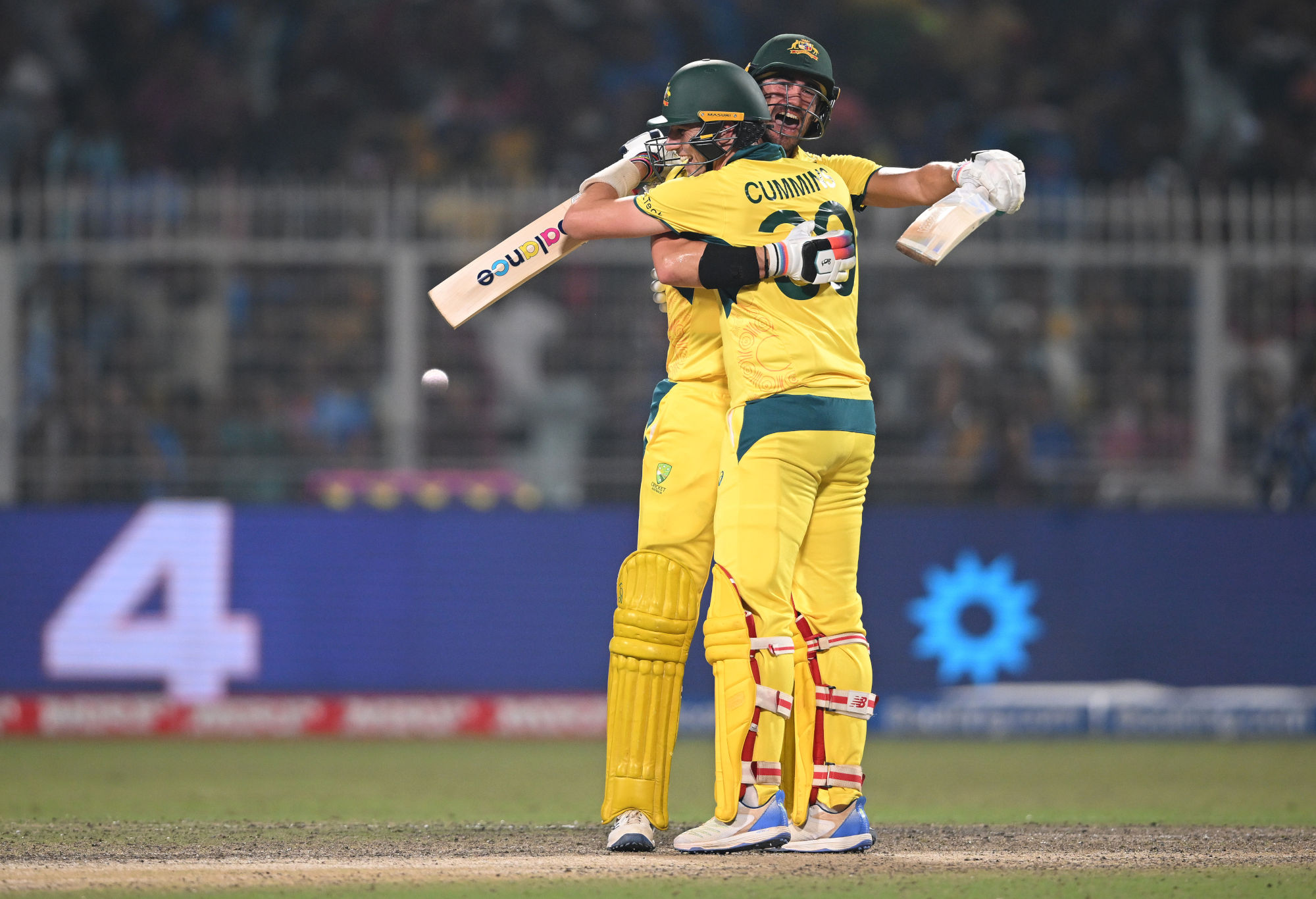 Mitchell Starc and Pat Cummins of Australia celebrate victory over South Africa.