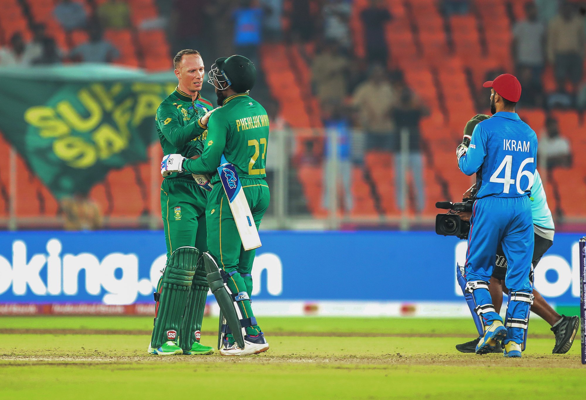 Andile Phehlukwayo and Rassie van der Dussen celebrate South Africa's win over Afghanistan.