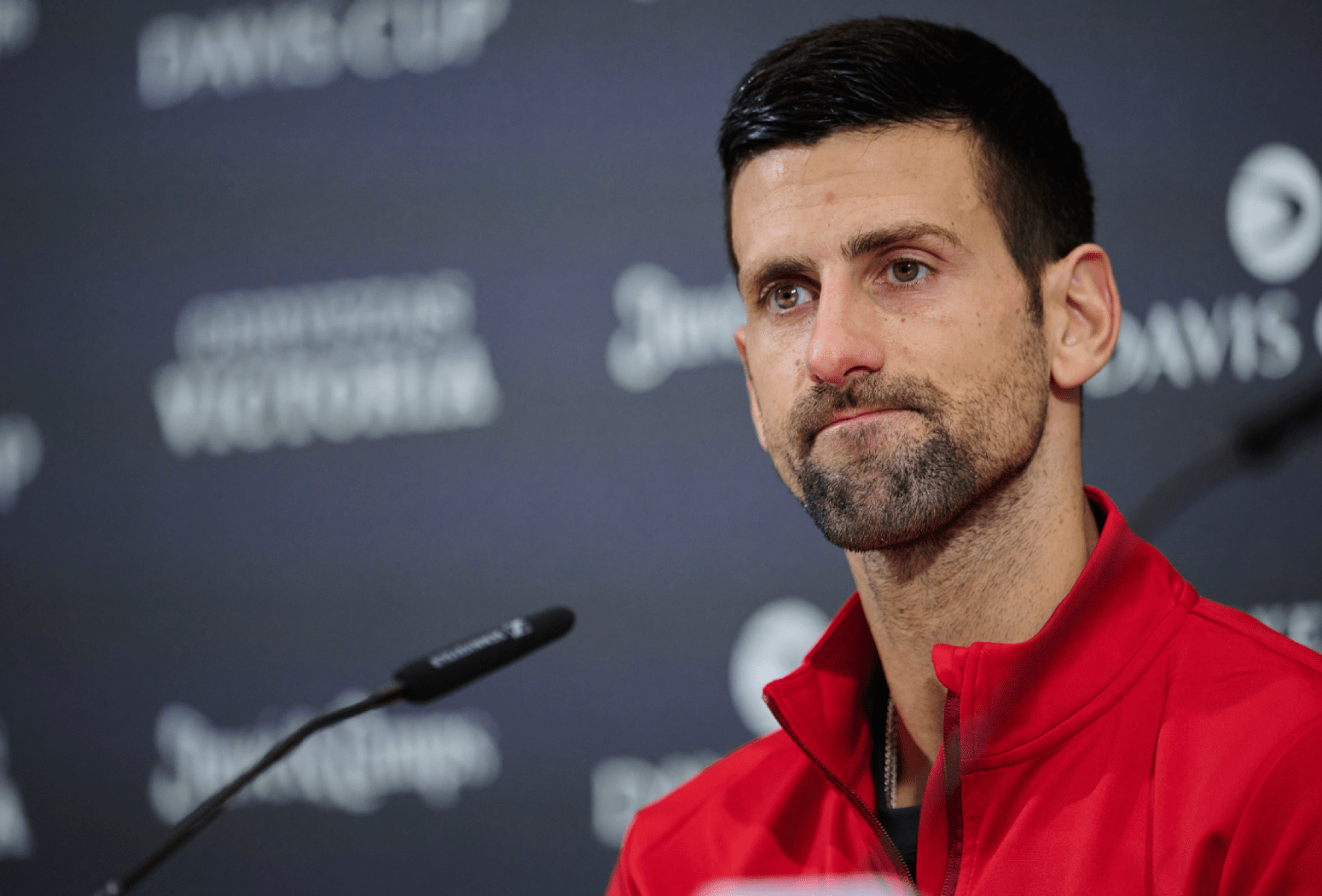 Novak Djokovic of Serbia looks on in press conference after the Semi-Final match against Jannik Sinner and Lorenzo Sonego of Italy in Davis Cup Final at Palacio de Deportes Jose Maria Martin Carpena on November 25, 2023 in Malaga, Spain. (Photo by Francisco Macia/Quality Sport Images/Getty Images)