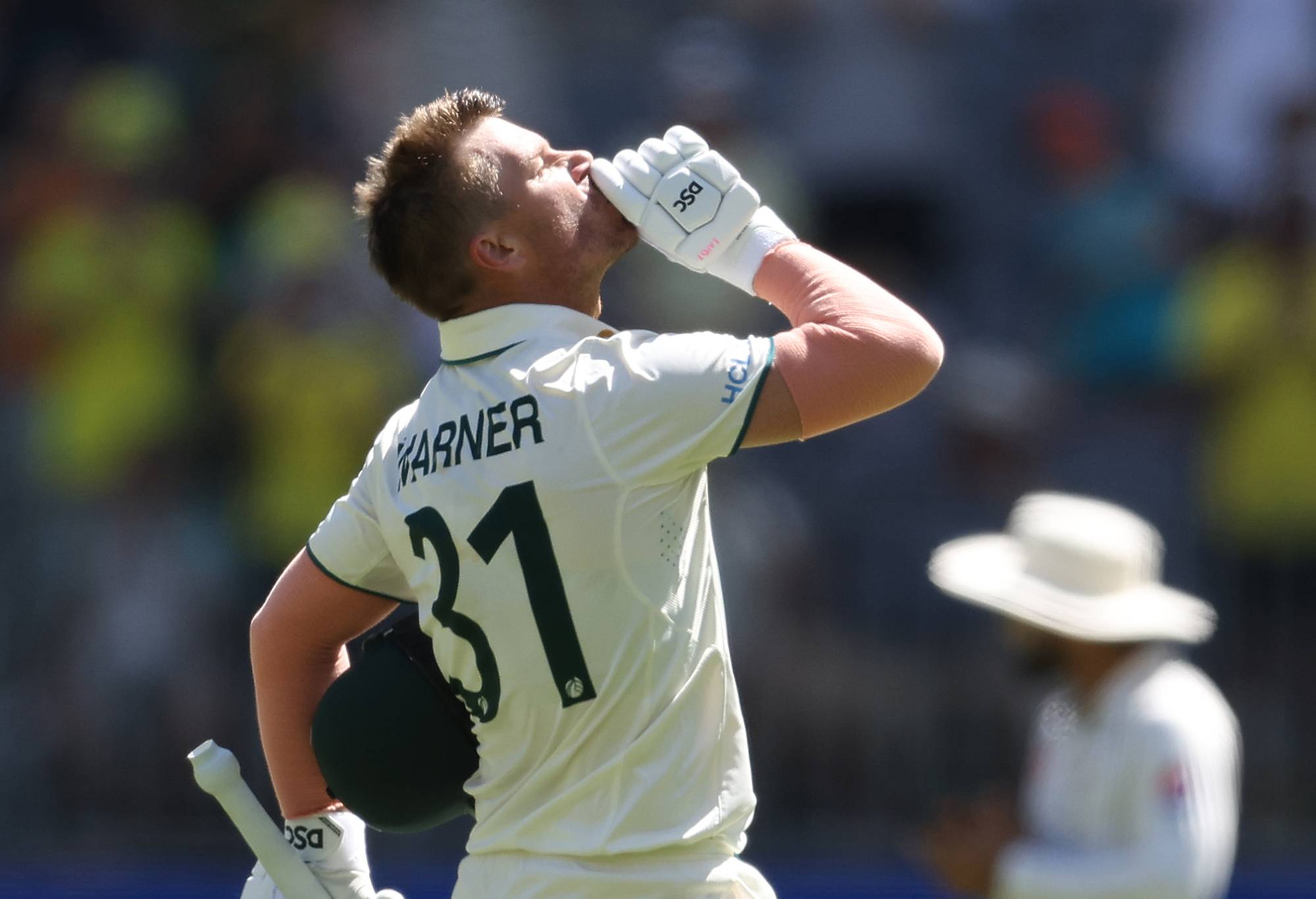 David Warner of Australia celebrates after scoring a century during day one of the Men's First Test match between Australia and Pakistan at Optus Stadium on December 14, 2023 in Perth, Australia. (Photo by Paul Kane/Getty Images)