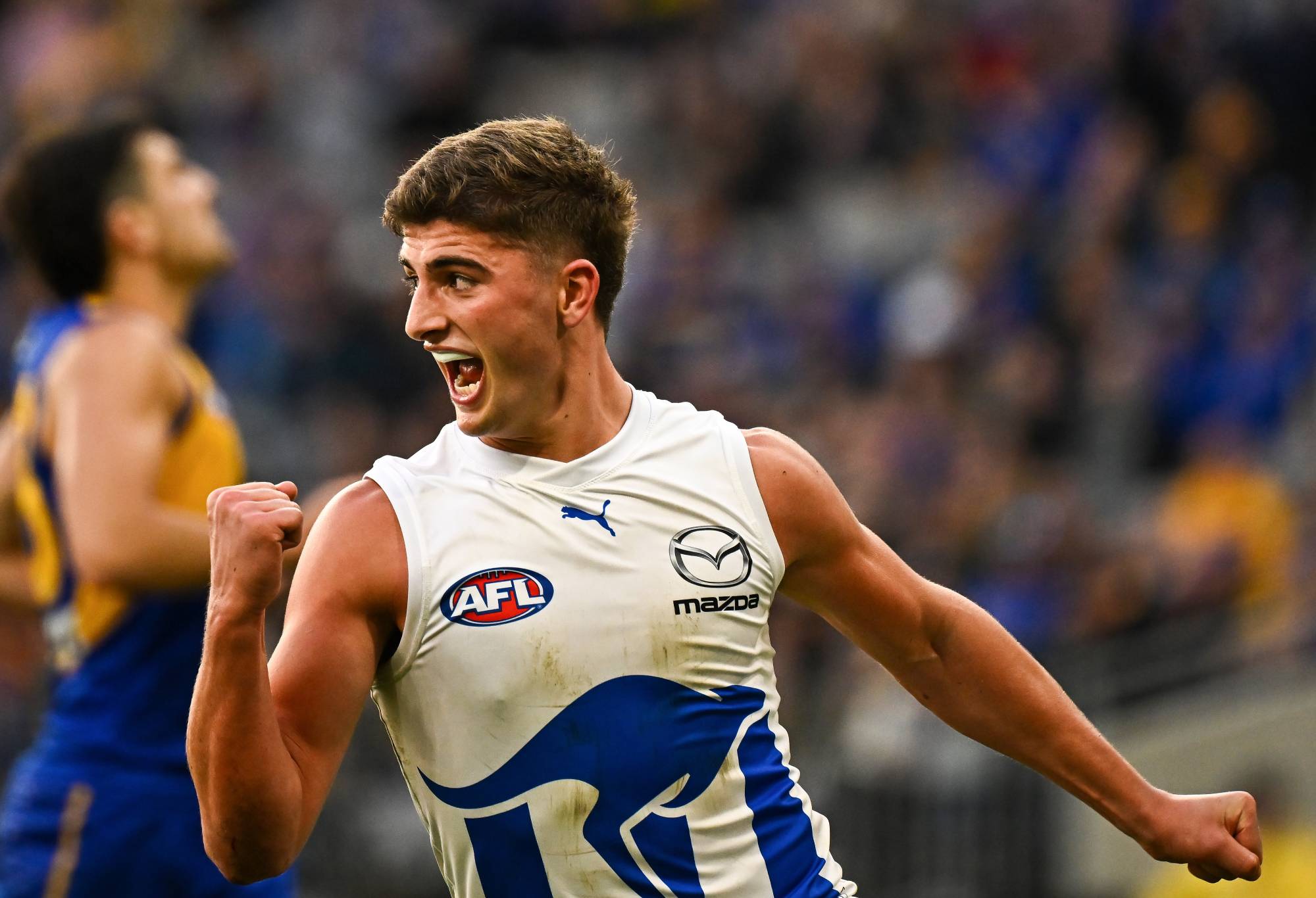PERTH, AUSTRALIA - JULY 30: Harry Sheezel celebrates a goal during the 2023 AFL Round 20 match between the West Coast Eagles and the North Melbourne Kangaroos at Optus Stadium on July 30, 2023 in Perth, Australia. (Photo by Daniel Carson/AFL Photos via Getty Images)