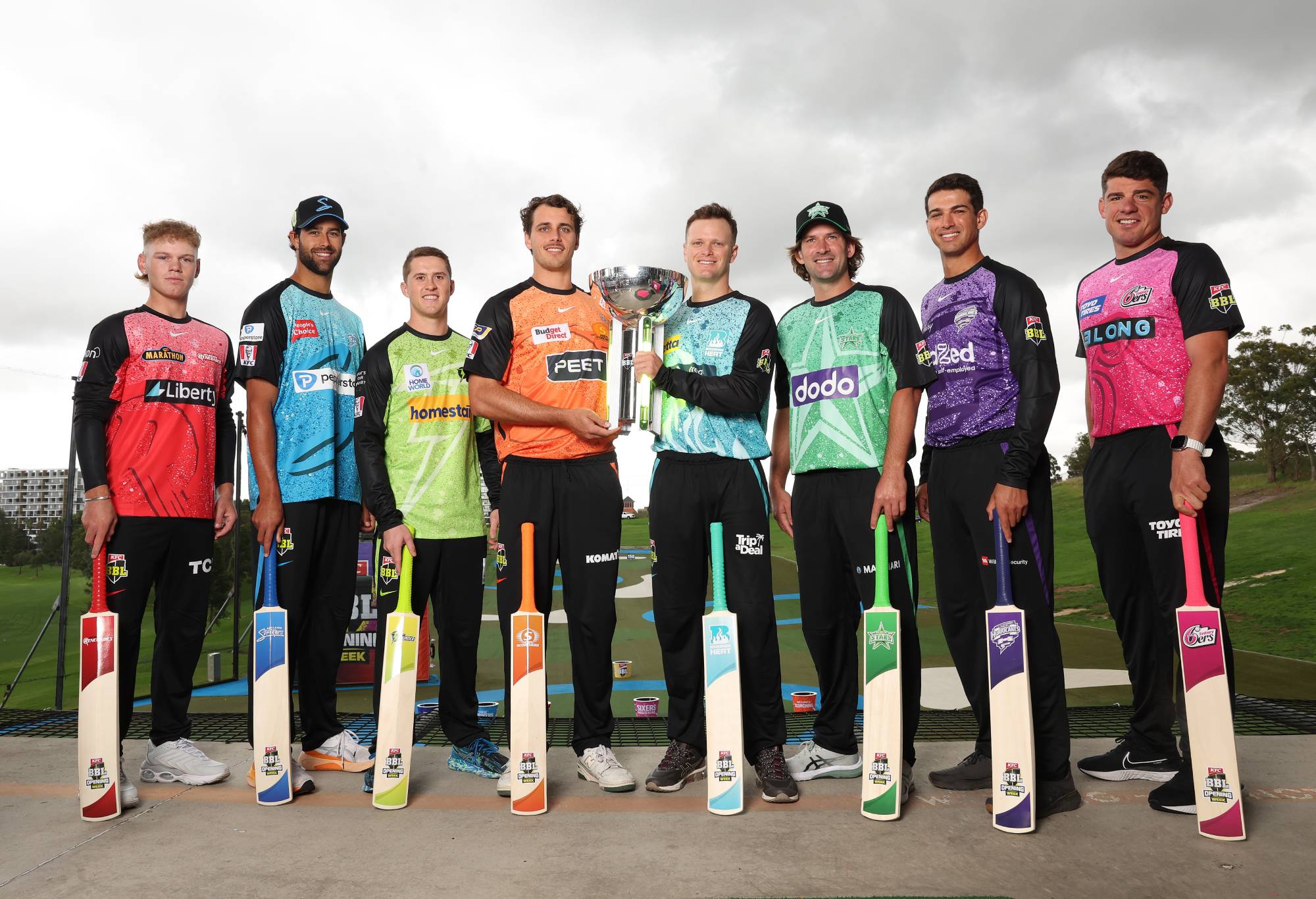 SYDNEY, AUSTRALIA - DECEMBER 04: (L-R) Jake Fraser-McGurk of the Melbourne Renegades; Wes Agar of the Adelaide Strikers; Matt Gilkes of the Sydney Thunder; Lance Morris of the Perth Scorchers; Matt Kuhnemann of the Brisbane Heat; Joe Burns of the Melbourne Stars; Paddy Dooley of the Hobart Hurricanes and Moises Henriques of the Sydney Sixers pose during the 2023-24 Big Bash League season launch at the Moore Park Driving Range on December 04, 2023 in Sydney, Australia. (Photo by Mark Metcalfe/Getty Images for Cricket Australia)