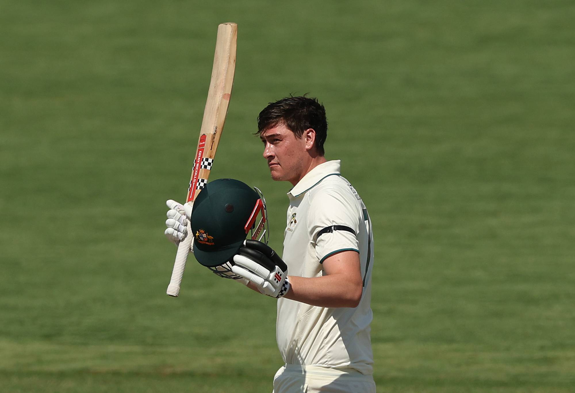 CANBERRA, AUSTRALIA - DECEMBER 08: Matthew Renshaw of the Prime Ministers XI celebrates and acknowledges the crowd after scoring a century during day three of the Tour Match between PM's XI and Pakistan at Manuka Oval on December 08, 2023 in Canberra, Australia. (Photo by Mark Metcalfe/Getty Images)