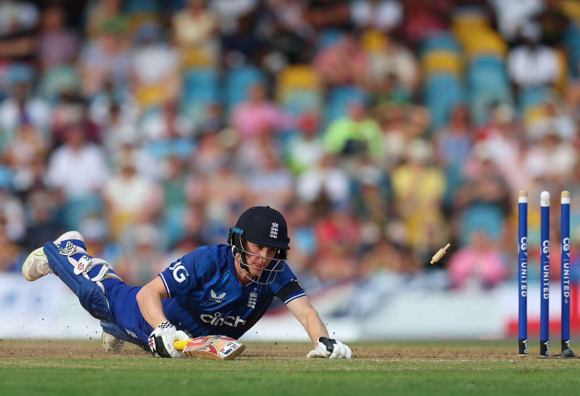 BRIDGETOWN, BARBADOS - DECEMBER 09: Harry Brook of England is run-out by Alzarri Joseph of West Indies during the third CG United One Day International match between West Indies and England at Kensington Oval on December 09, 2023 in Bridgetown, Barbados. (Photo by Ashley Allen/Getty Images)