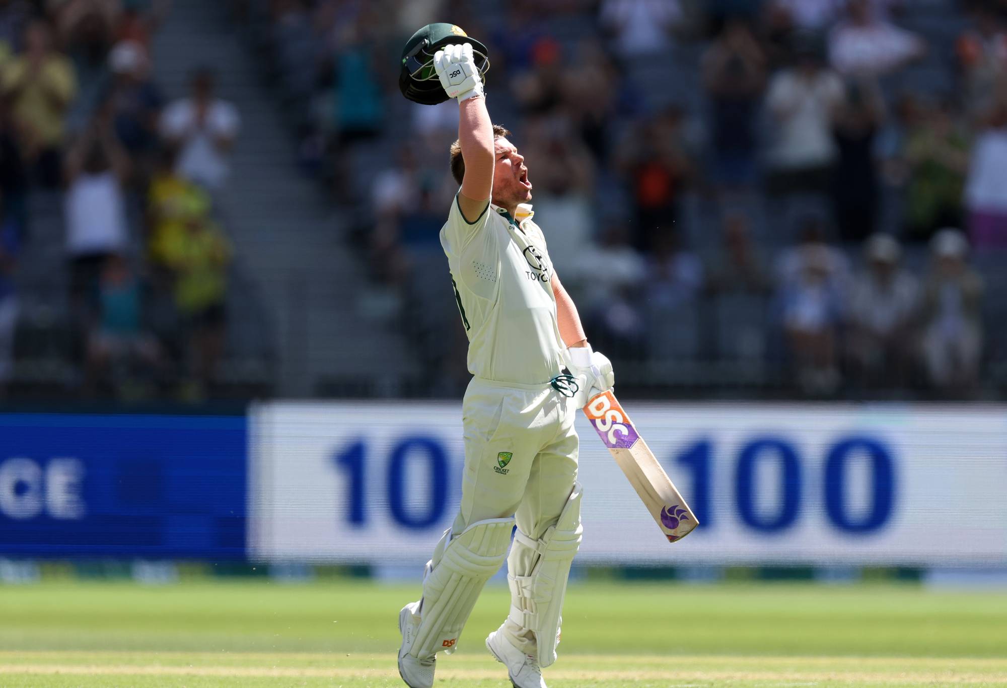 PERTH, AUSTRALIA - DECEMBER 14: David Warner of Australia celebrates after scoring a century during day one of the Men's First Test match between Australia and Pakistan at Optus Stadium on December 14, 2023 in Perth, Australia. (Photo by Paul Kane/Getty Images)