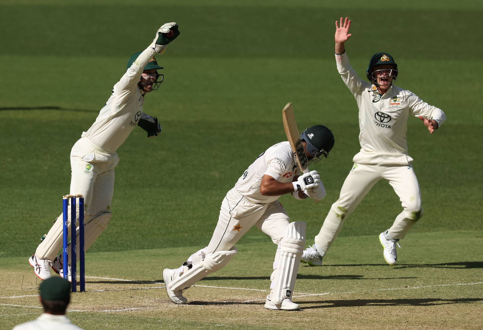 PERTH, AUSTRALIA - DECEMBER 15: Alex Carey and Marnus Labuschagne of Australia unsuccessfully appeal for the wicket of Abdullah Shafique of Pakistan during day two of the Men's First Test match between Australia and Pakistan at Optus Stadium on December 15, 2023 in Perth, Australia (Photo by Paul Kane/Getty Images)