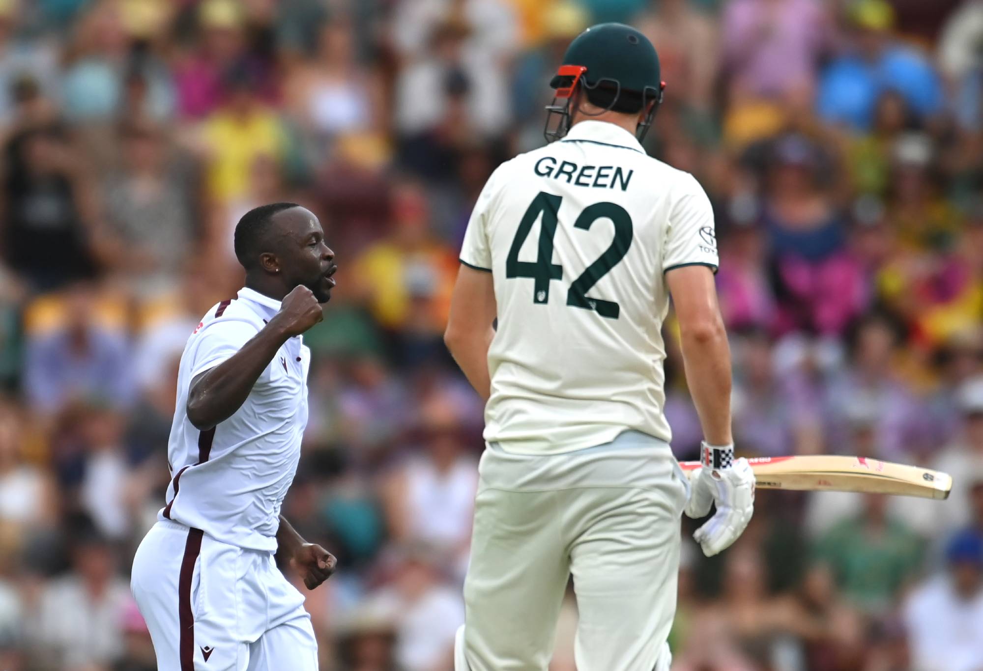 BRISBANE, AUSTRALIA - JANUARY 26: Kemar Roach of West Indies celebrates dismissing Cameron Green of Australia  during day two of the Second Test match in the series between Australia and West Indies at The Gabba on January 26, 2024 in Brisbane, Australia. (Photo by Albert Perez - CA/Cricket Australia via Getty Images)
