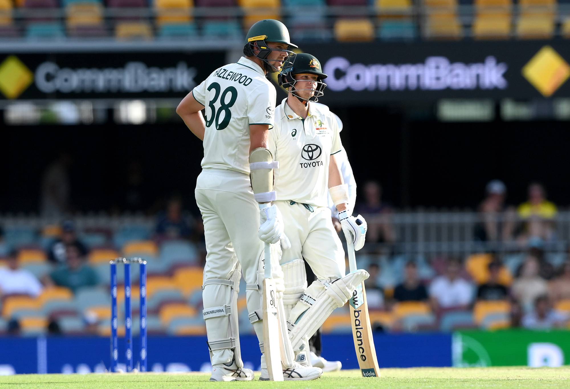 BRISBANE, AUSTRALIA - JANUARY 28: Steve Smith and Josh Hazlewood of Australia talk tactics during day four of the Second Test match in the series between Australia and West Indies at The Gabba on January 28, 2024 in Brisbane, Australia. (Photo by Bradley Kanaris/Getty Images)