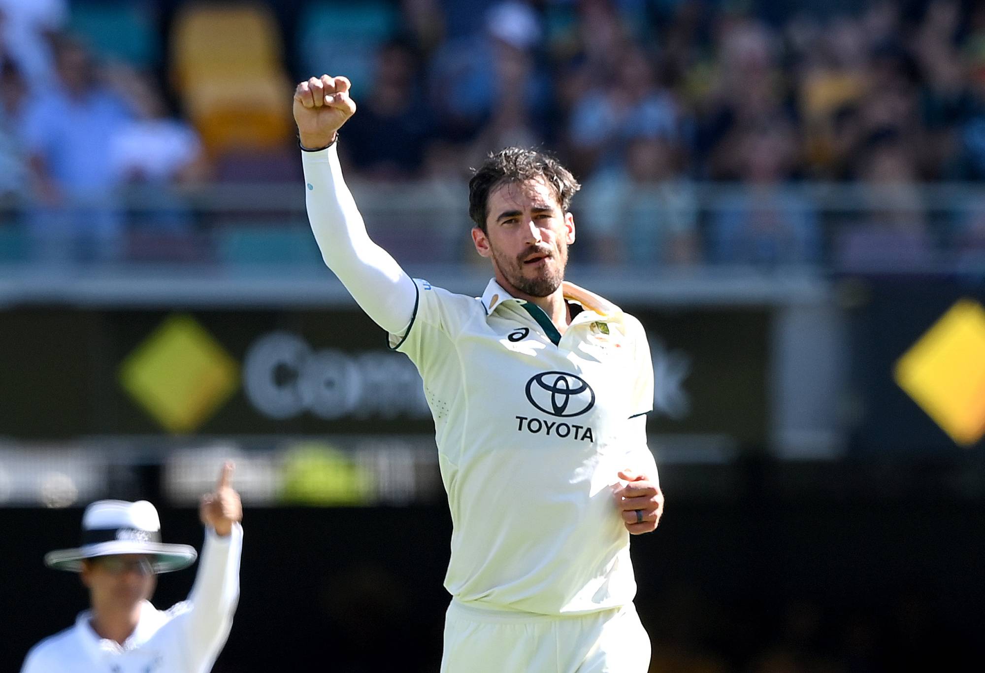 BRISBANE, AUSTRALIA - JANUARY 25: Mitchell Starc of Australia celebrates taking the wicket of Alick Athanaze of the West Indies during day one of the Second Test match in the series between Australia and West Indies at The Gabba on January 25, 2024 in Brisbane, Australia.