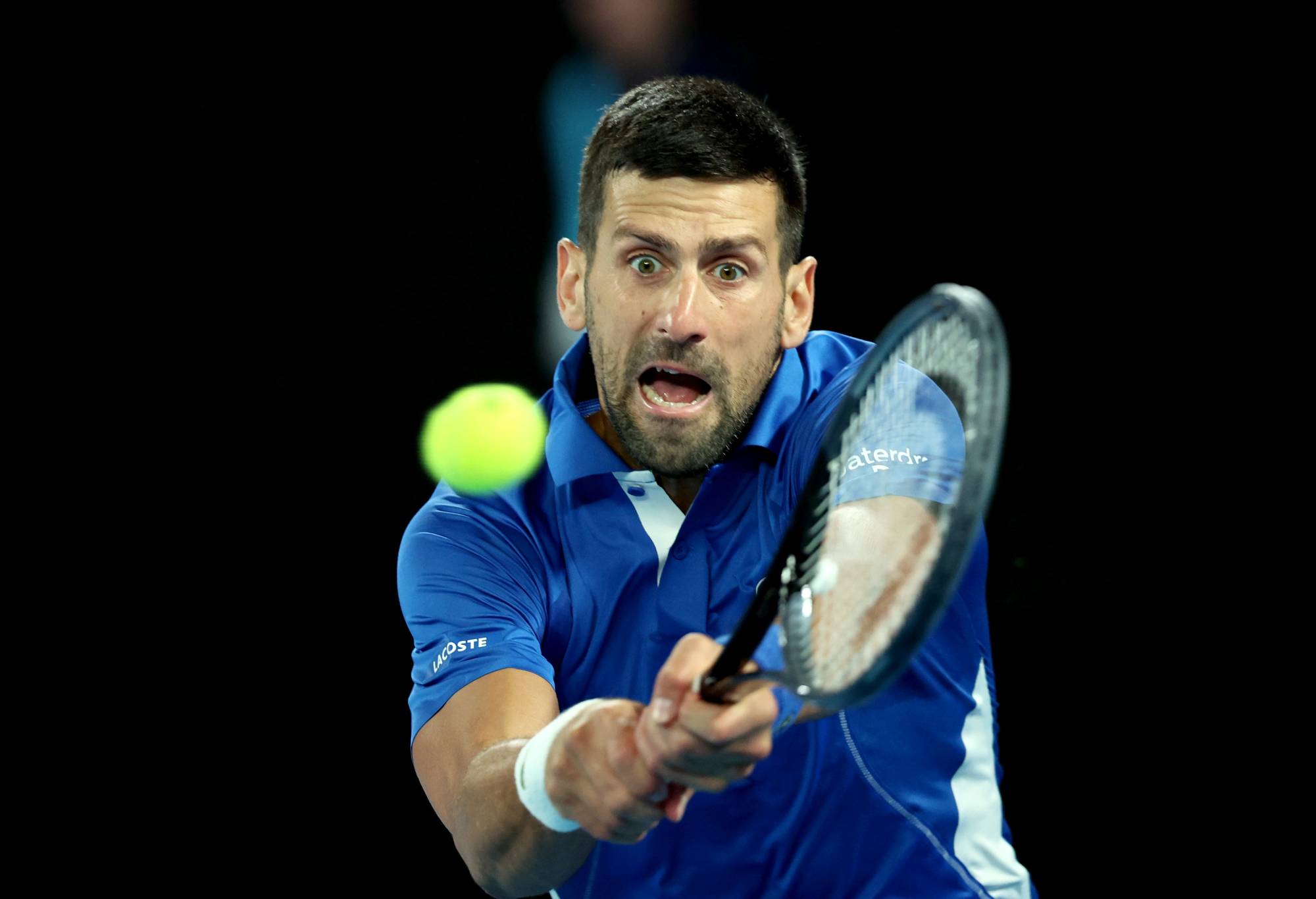 Novak Djokovic of Serbia plays a backhand in their round two singles match against Alexei Popyrin of Australia during the 2024 Australian Open at Melbourne Park on January 17, 2024 in Melbourne, Australia. (Photo by Daniel Pockett/Getty Images)