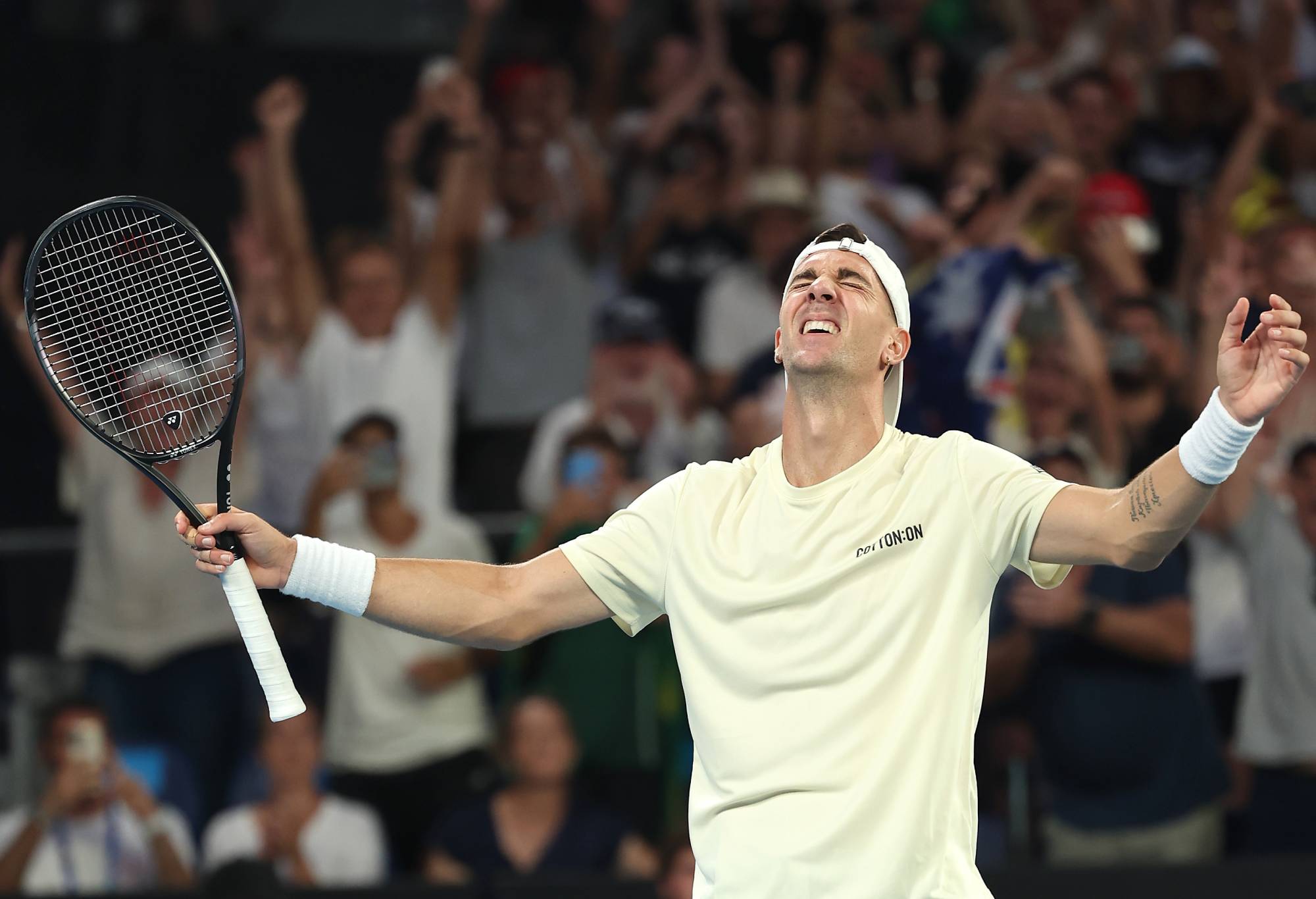Thanasi Kokkinakis of Australia celebrates match point in their round one singles match against Sebastian Ofner of Austria during the 2024 Australian Open at Melbourne Park on January 16, 2024 in Melbourne, Australia. (Photo by Phil Walter/Getty Images)