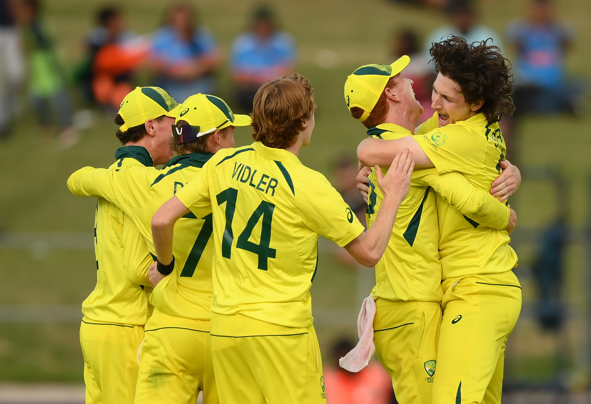 Australian players celebrate victory after defeating India in the U19 World Cup final.