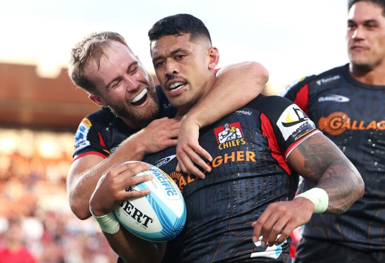 Xavier Roe (l) and Quinn Tupaea (r) of the Chiefs celebrate with Etene Nanai-Seturo (c) of the Chiefs after he scored try during the round one Super Rugby Pacific match between Chiefs and Crusaders at FMG Stadium Waikato, on February 23, 2024, in Hamilton, New Zealand. (Photo by Phil Walter/Getty Images)
