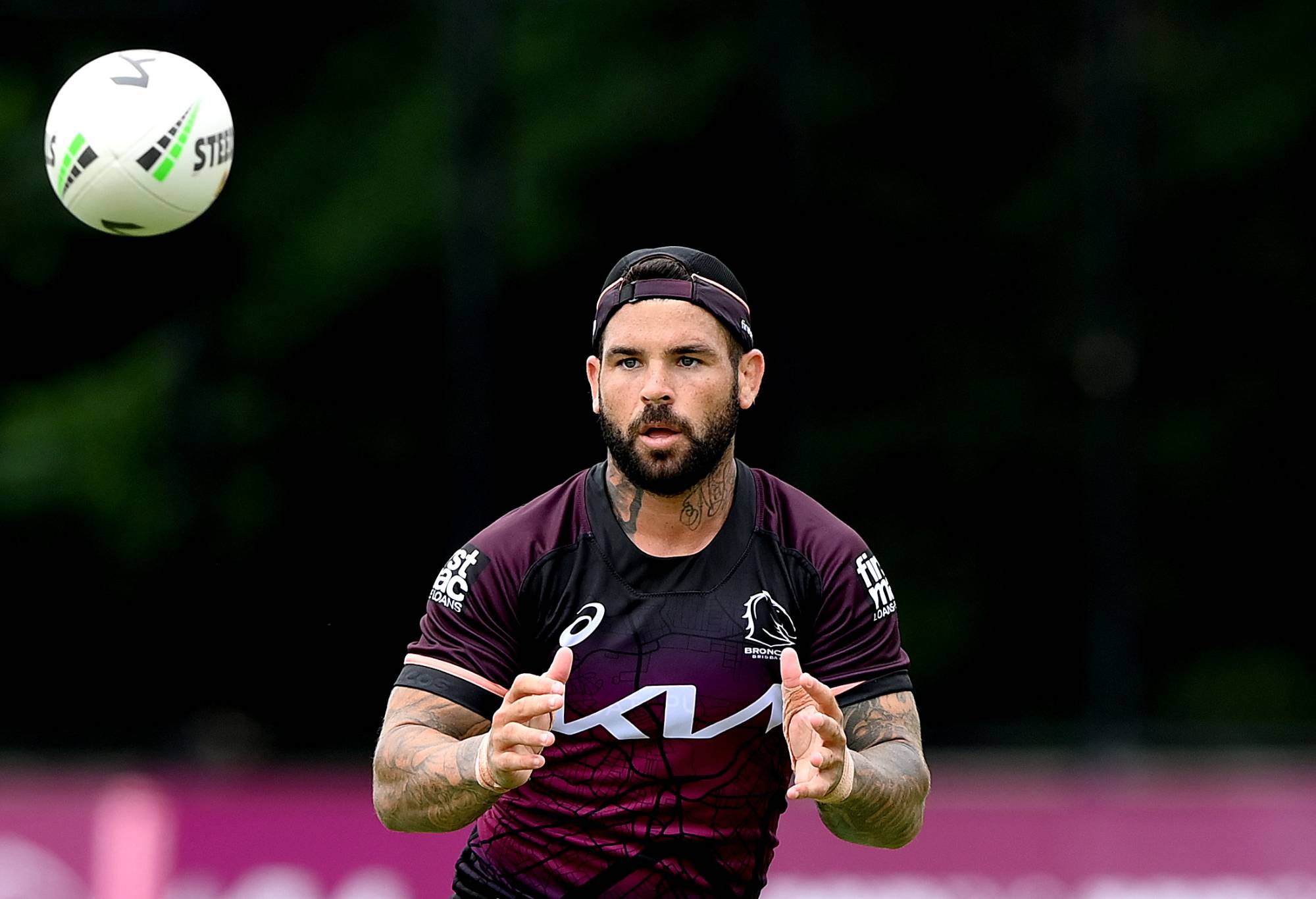 BRISBANE, AUSTRALIA - FEBRUARY 07: Adam Reynolds catches the ball during a Brisbane Broncos NRL training session at Clive Berghofer Field on February 07, 2024 in Brisbane, Australia. (Photo by Bradley Kanaris/Getty Images)