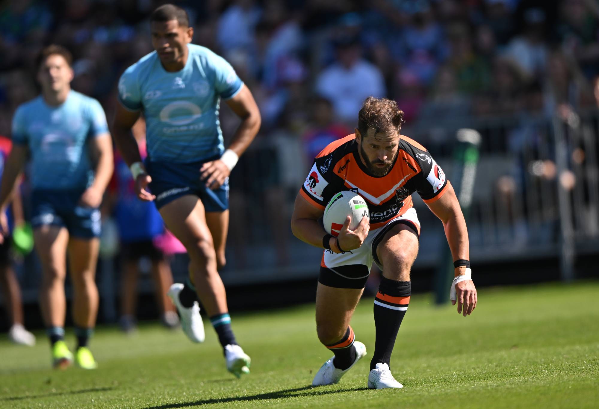 CHRISTCHURCH, NEW ZEALAND - FEBRUARY 18: Aidan Sezer of the Wests Tigers dives over to score a try during the NRL Pre-season challenge match between New Zealand Warriors and Wests Tigers at Apollo Projects Stadium on February 18, 2024 in Christchurch, New Zealand. (Photo by Kai Schwoerer/Getty Images)