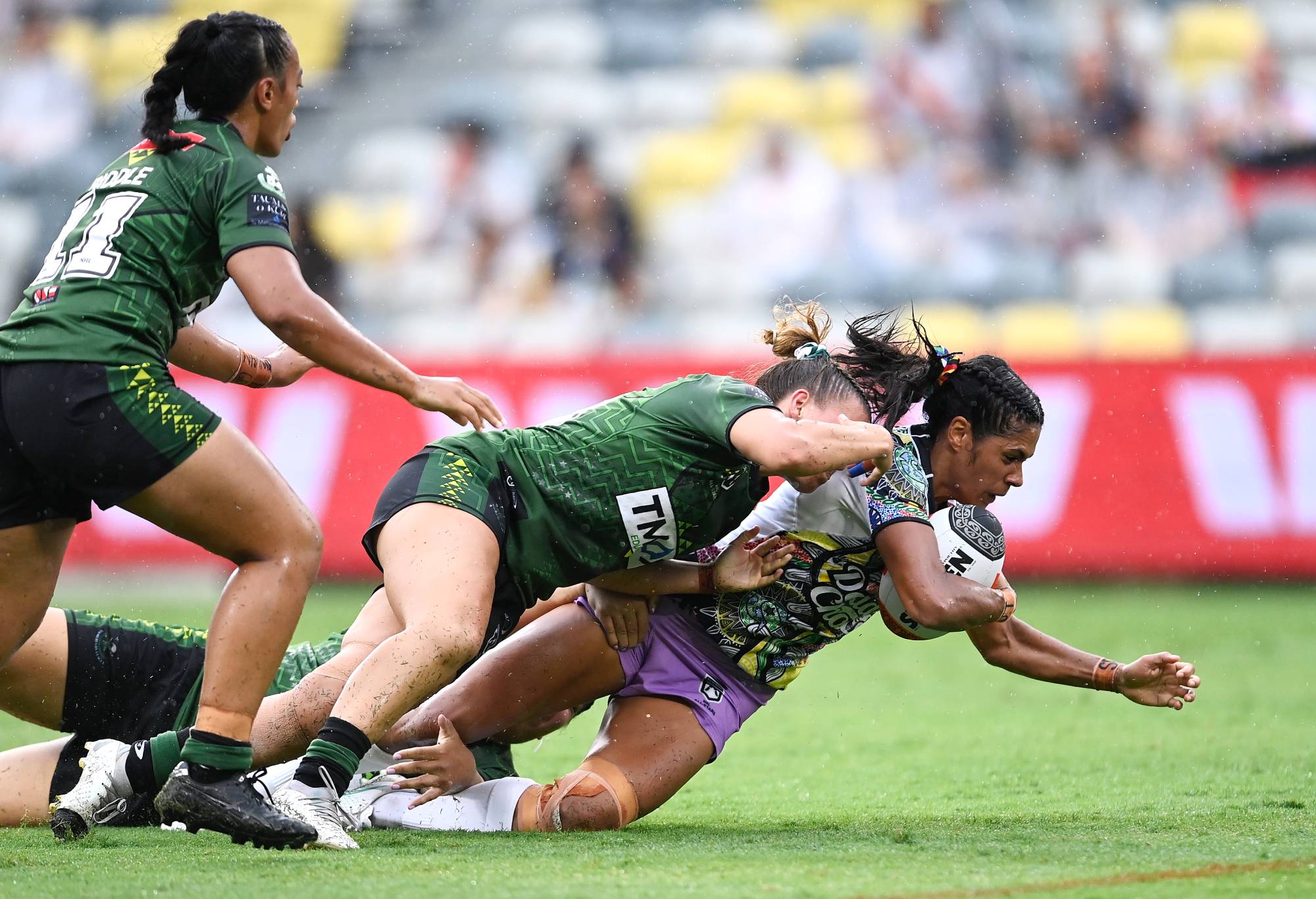 TOWNSVILLE, AUSTRALIA - FEBRUARY 16: Kimberley Hunt of the Indigenous All-Stars is tackled during the NRL All-Stars match between Women's Australia Indigenous All Stars and Aotearoa NZ Maori Tane All Stars at Queensland Country Bank Stadium on February 16, 2024 in Townsville, Australia. (Photo by Ian Hitchcock/Getty Images)