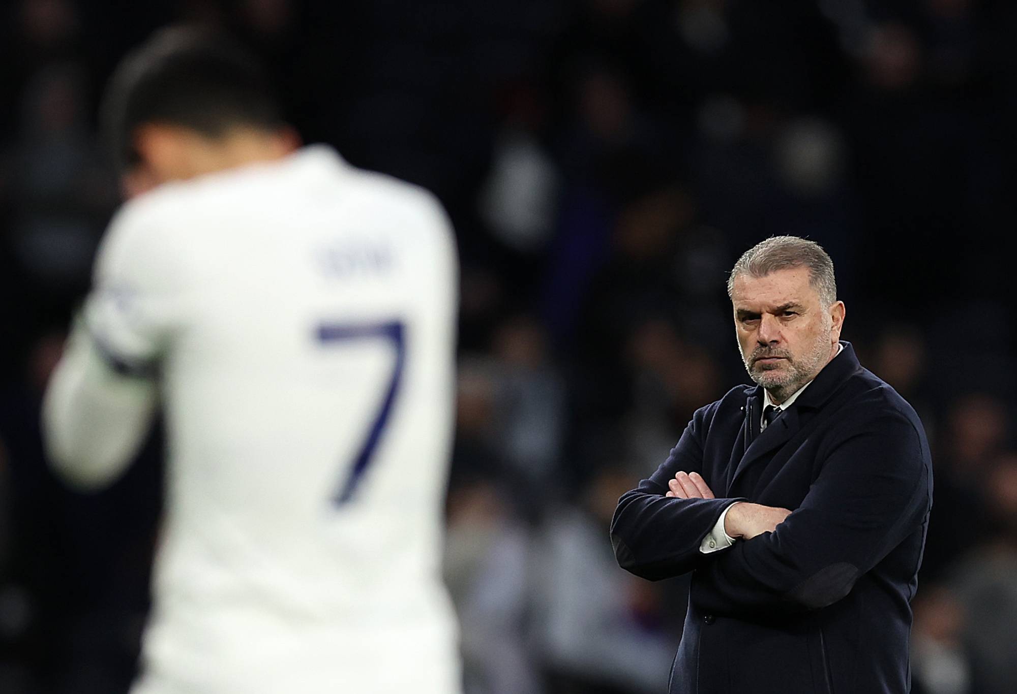 LONDON, ENGLAND - FEBRUARY 17: Ange Postecoglou, Manager of Tottenham Hotspur, looks dejected as Heung-Min Son of Spurs walks off after the team's defeat during the Premier League match between Tottenham Hotspur and Wolverhampton Wanderers at Tottenham Hotspur Stadium on February 17, 2024 in London, England. (Photo by Julian Finney/Getty Images)