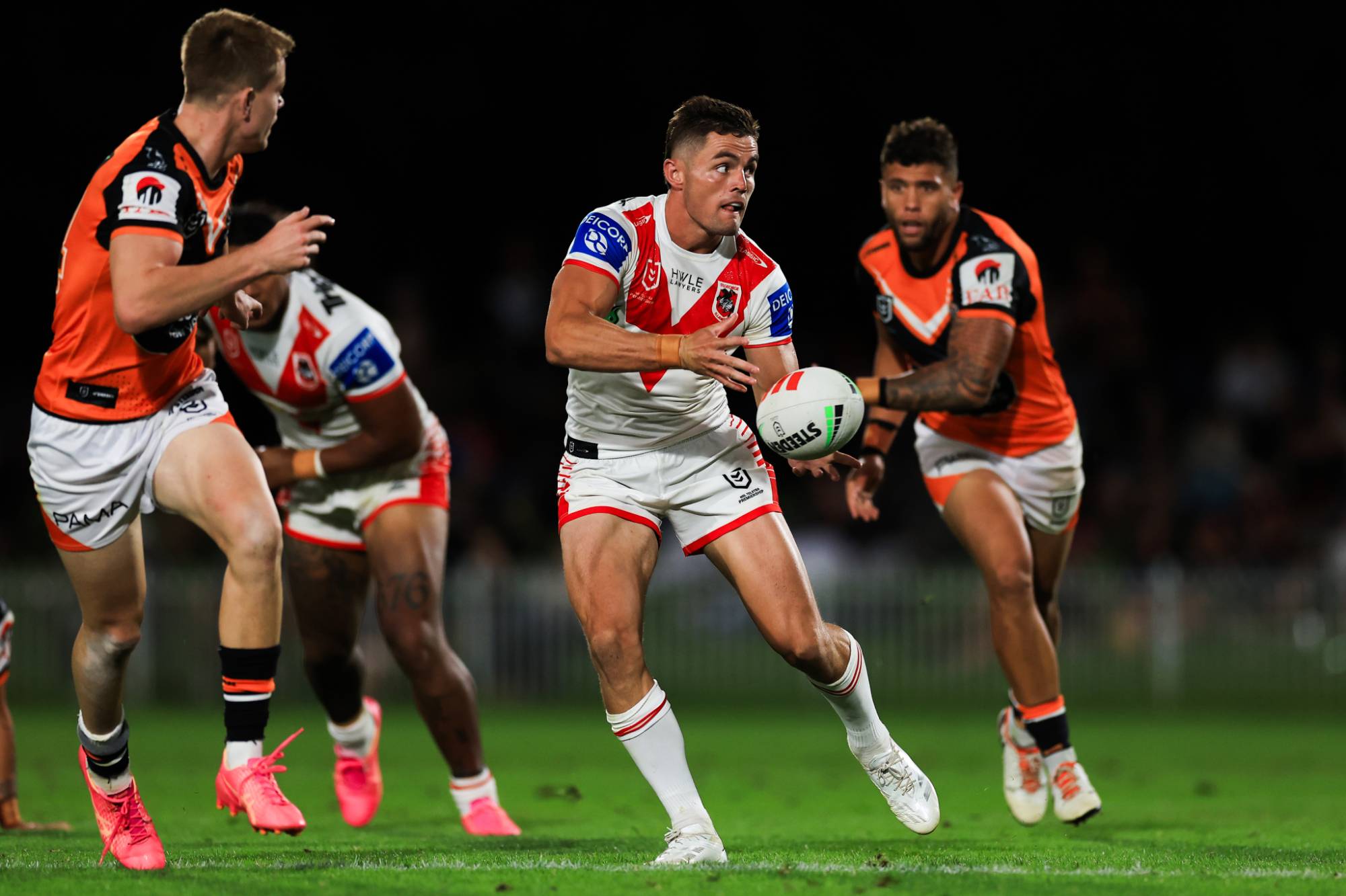 MUDGEE, AUSTRALIA - FEBRUARY 24: Kyle Flanagan of the Dragons passes during the NRL Pre-season challenge match between St George Illawarra Dragons and Wests Tigers at Glen Willow Sporting Complex on February 24, 2024 in Mudgee, Australia. (Photo by Mark Evans/Getty Images)
