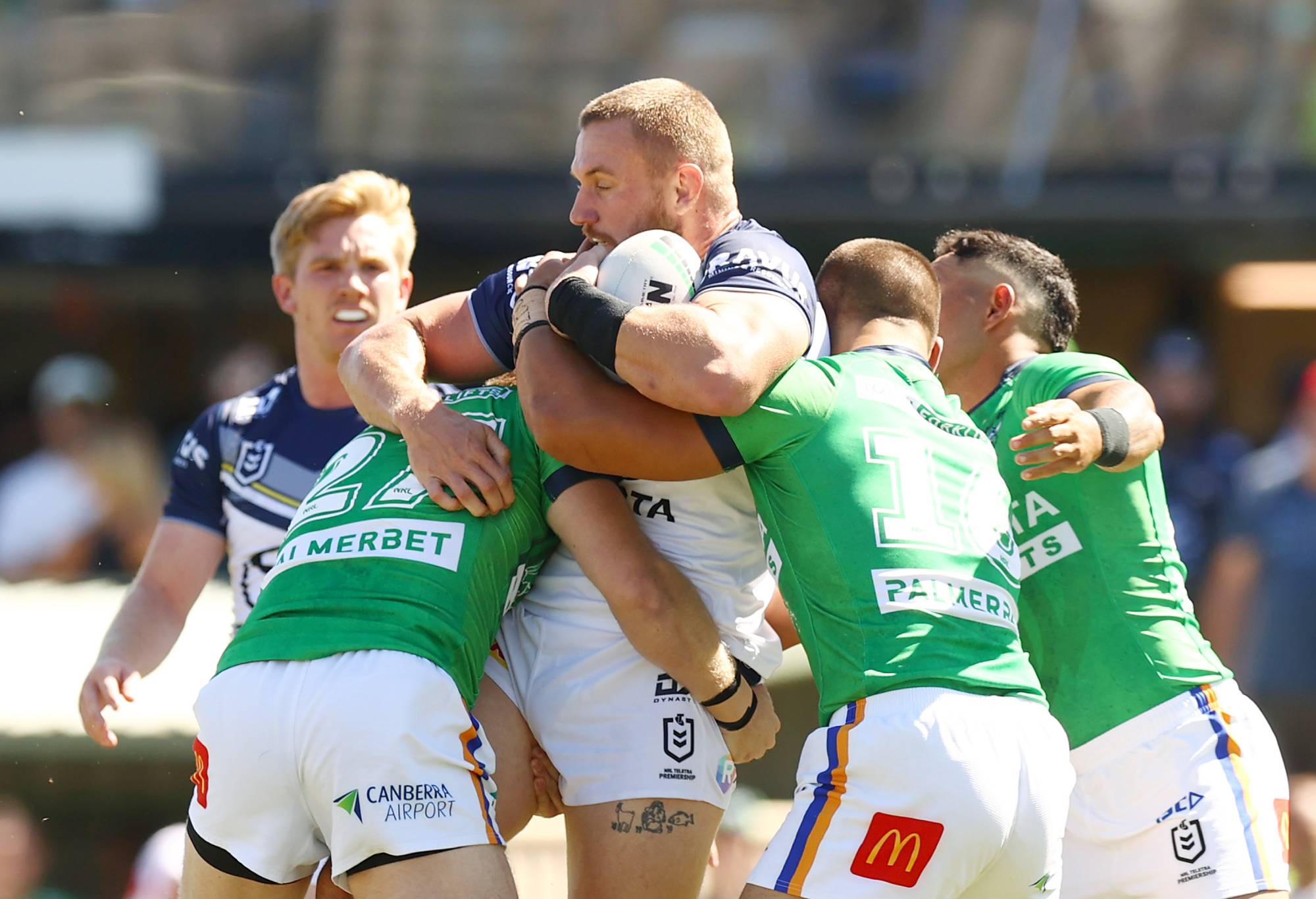 QUEANBEYAN, AUSTRALIA - FEBRUARY 25: Coen Hess of the Cowboys is tackled during the NRL Pre-season challenge match between Canberra Raiders and North Queensland Cowboys at Seiffert Oval on February 25, 2024 in Queanbeyan, Australia. (Photo by Mark Nolan/Getty Images)