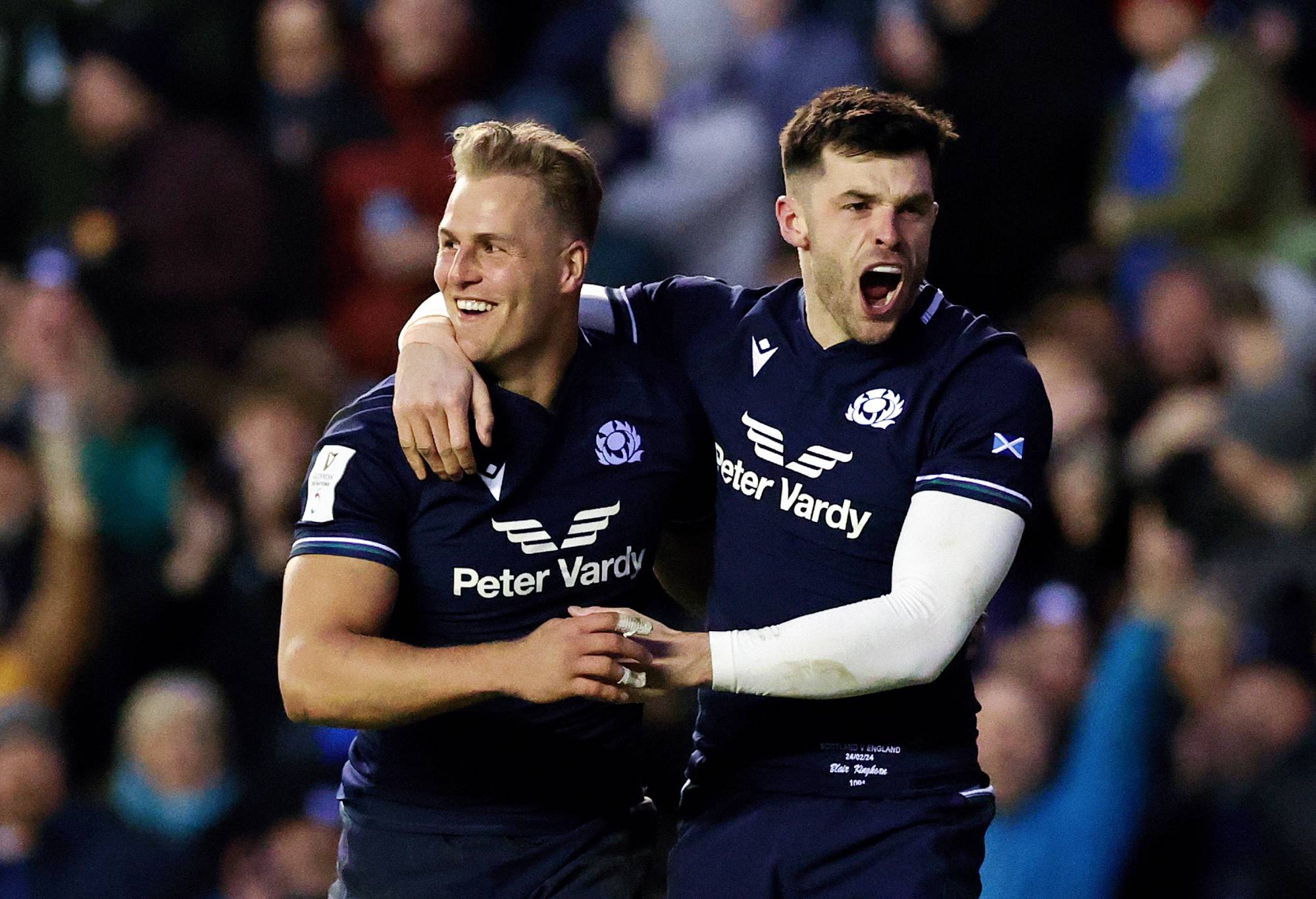 Duhan van der Merwe of Scotland celebrates scoring his team's third try with teammate Blair Kinghorn during the Guinness Six Nations 2024 match between Scotland and England at BT Murrayfield Stadium on February 24, 2024 in Edinburgh, Scotland. (Photo by David Rogers/Getty Images)