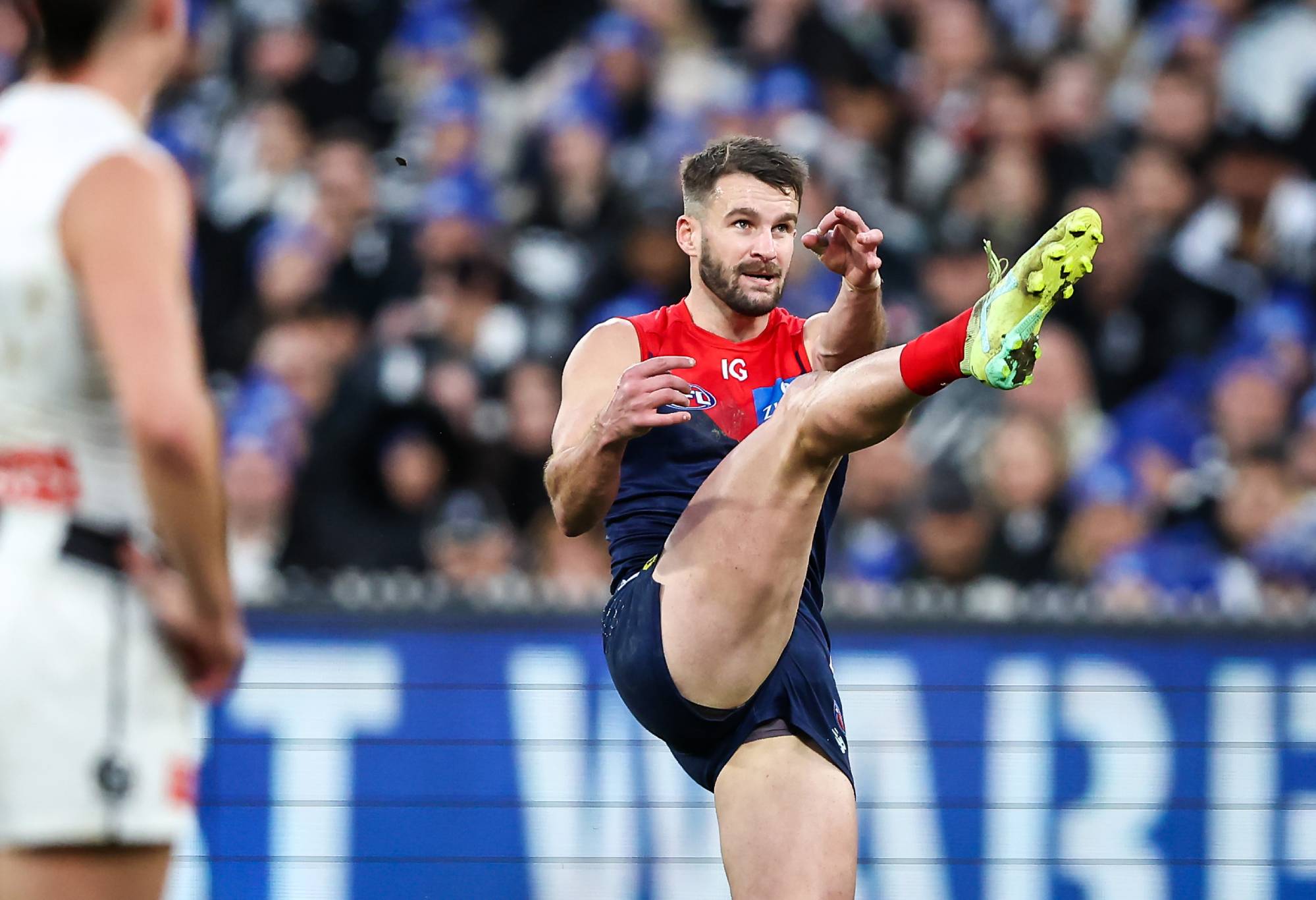 MELBOURNE, AUSTRALIA - JUNE 12: Joel Smith of the Demons kicks the ball during the 2023 AFL Round 13 match between the Melbourne Demons and the Collingwood Magpies at the Melbourne Cricket Ground on June 12, 2023 in Melbourne, Australia. (Photo by Dylan Burns/AFL Photos via Getty Images)