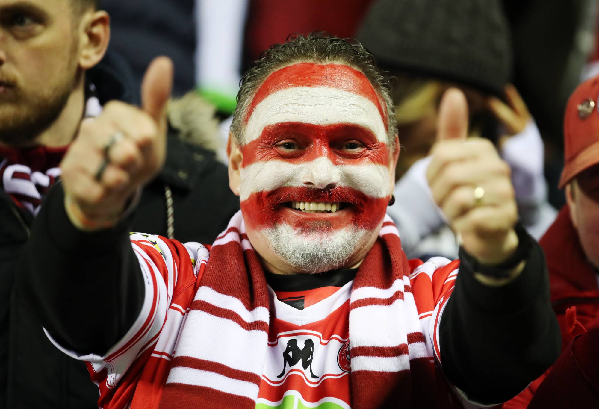 A Wigan Warriors fan celebrates following the Betfred World Club Challenge match at the DW Stadium, Wigan. Picture date: Saturday February 24, 2024. (Photo by Jess Hornby/PA Images via Getty Images)